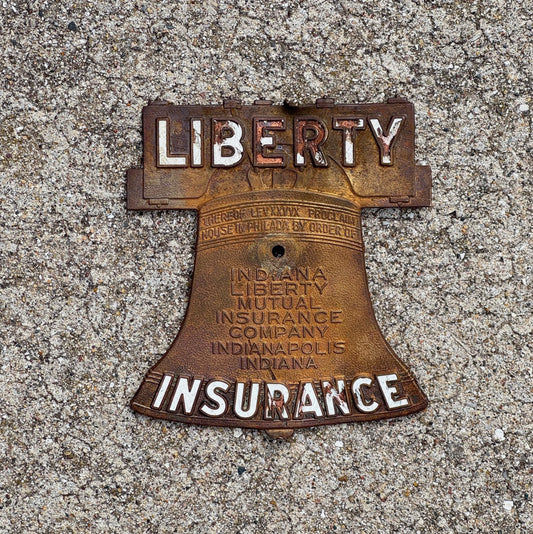 Photo of a 1950 Liberty Mutual Insurance Indiana License Plate Topper Auto Tag Garage Decor Vintage Radiator Badge Brass and Porcelain Bell with original patina