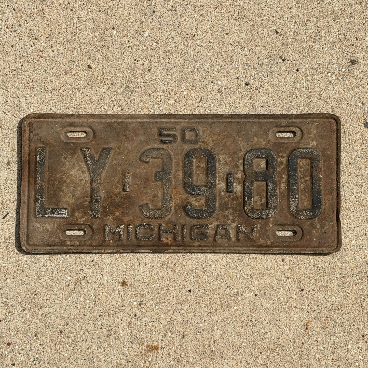 Photo of a 1950 Michigan License Plate Auto Tag Garage Decor Vintage LY 39 80 with original patina