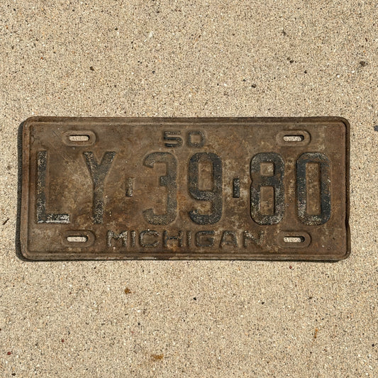 Photo of a 1950 Michigan License Plate Auto Tag Garage Decor Vintage LY 39 80 with original patina