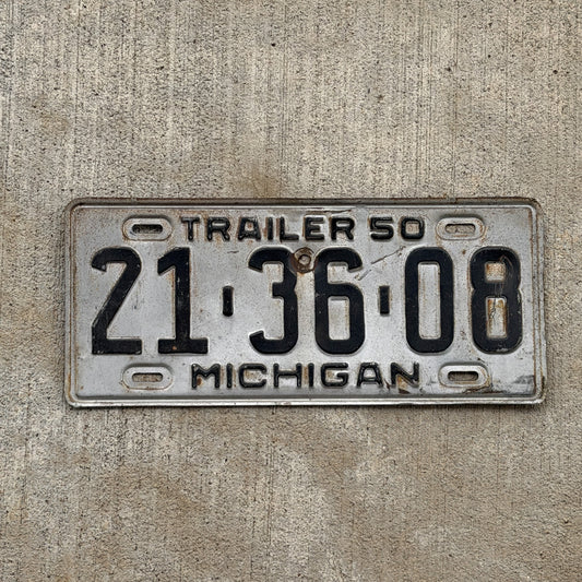 Photo of a 1950 Michigan Trailer License Plate Auto Tag Garage Decor Vintage 21 36 08 with original patina