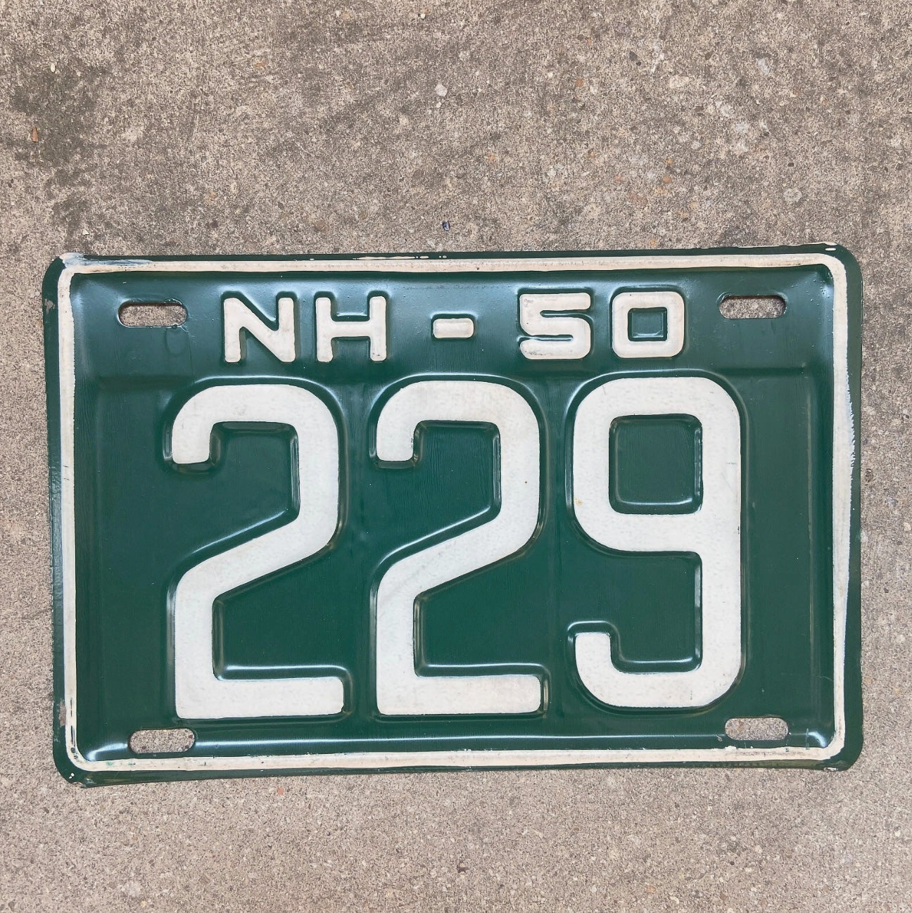 Photo of a 1950 New Hampshire License Plate Auto Tag Garage Decor Vintage Low Number Three Digit 229 with original patina