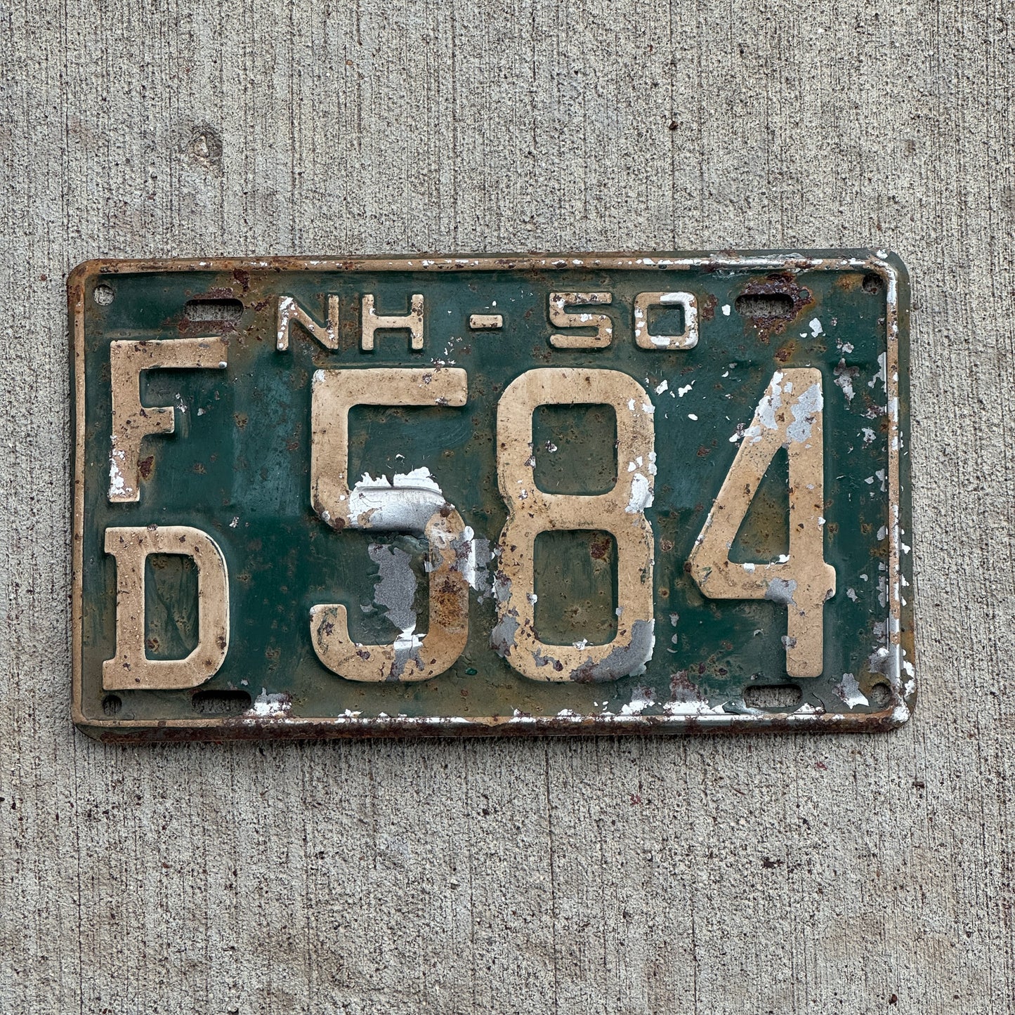 Photo of a 1950 New Hampshire License Plate Auto Tag Garage Decor Vintage Strafford County FD 584 with original patina