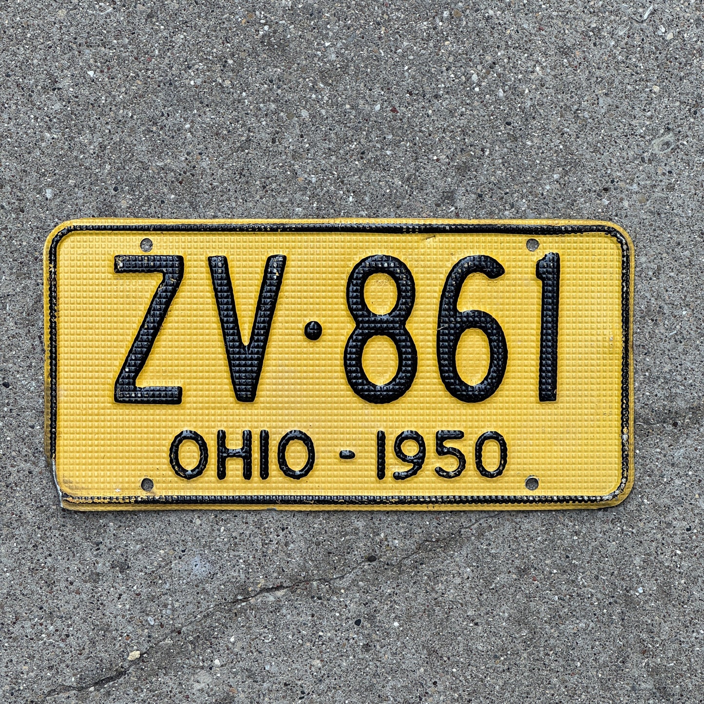 Photo of a 1950 Ohio License Plate Auto Tag Garage Decor Vintage Waffle Style ZV 861 with original patina