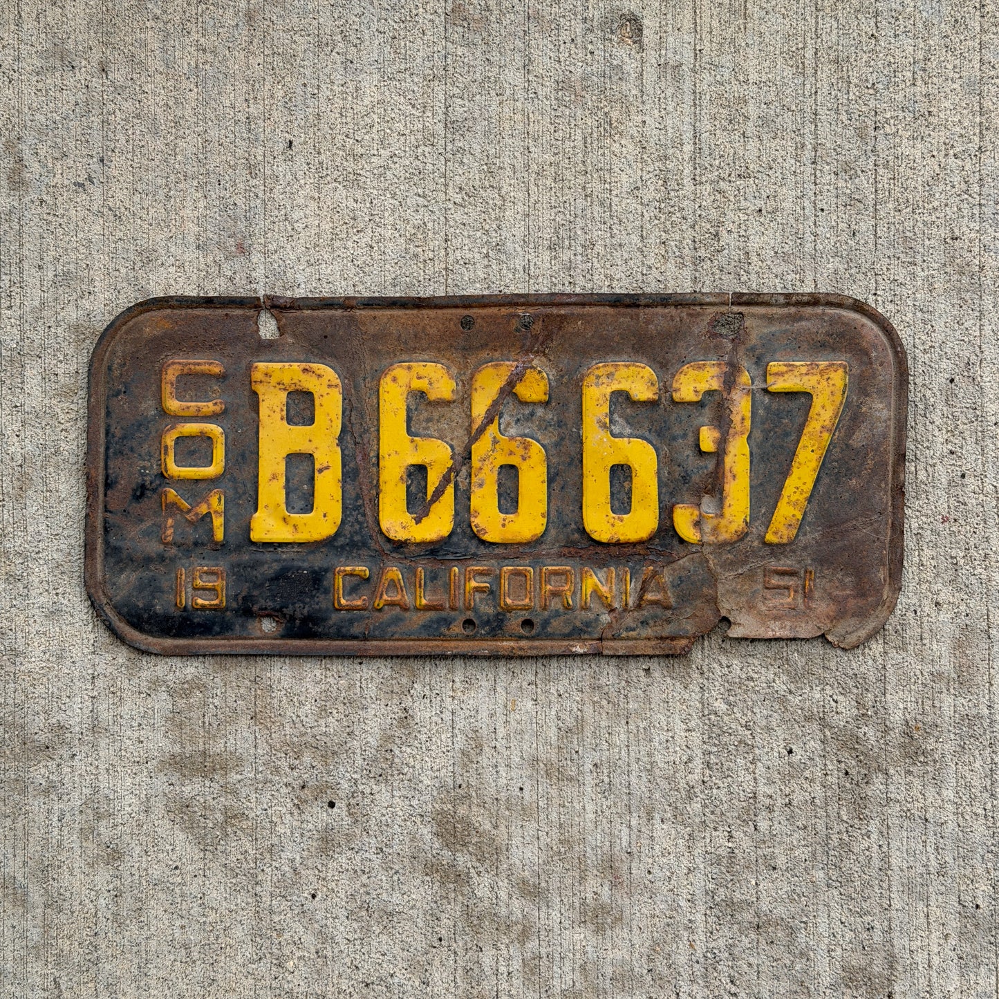 Photo of a 1951 California Commercial License Plate Auto Tag Garage Decor Vintage B 66637 with original patina