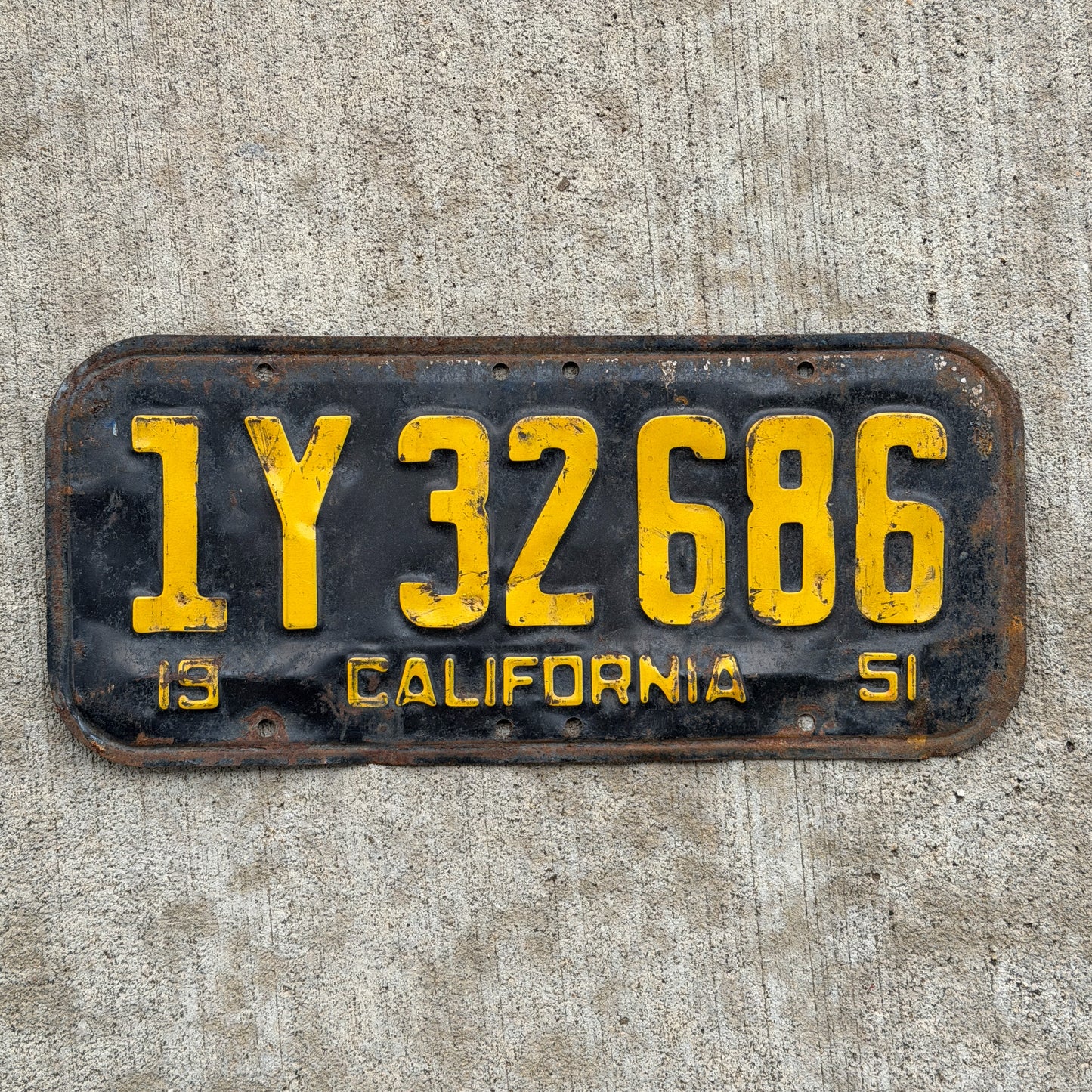 Photo of a 1951 California License Plate Auto Tag Garage Decor Vintage 1 Y 32686 with original patina