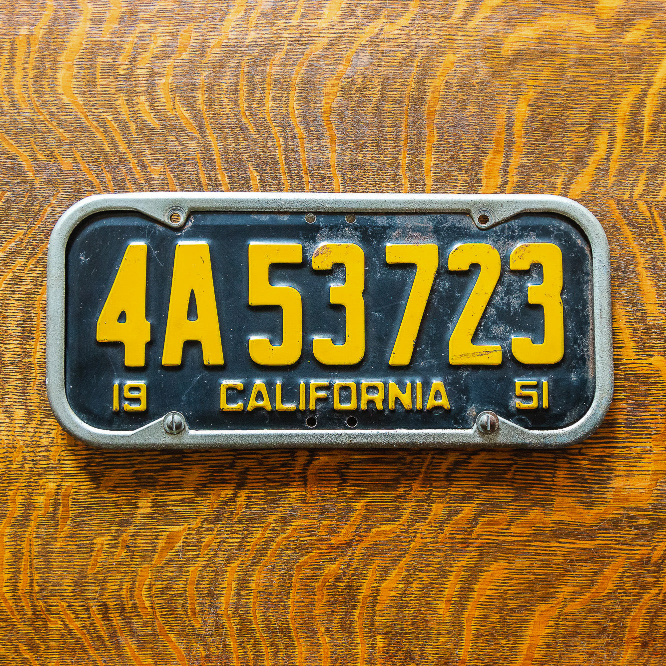 Photo of a 1951 California License Plate Auto Tag Garage Decor Vintage 4A 53723 with original patina