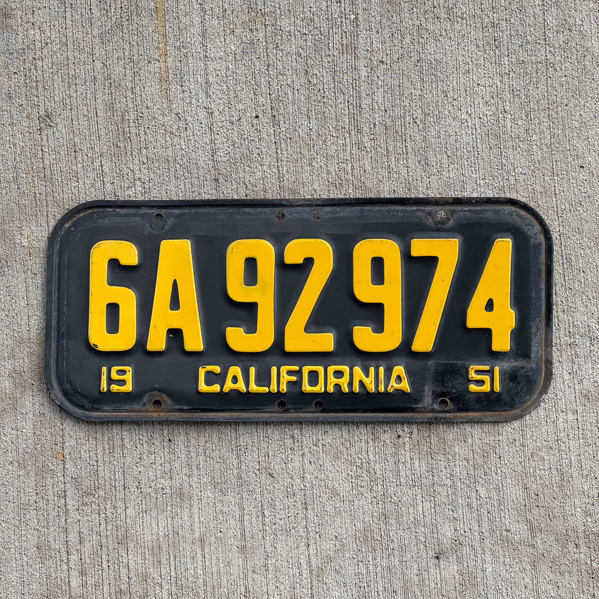 Photo of a 1951 California License Plate Auto Tag Garage Decor Vintage 6A 92974 with original patina