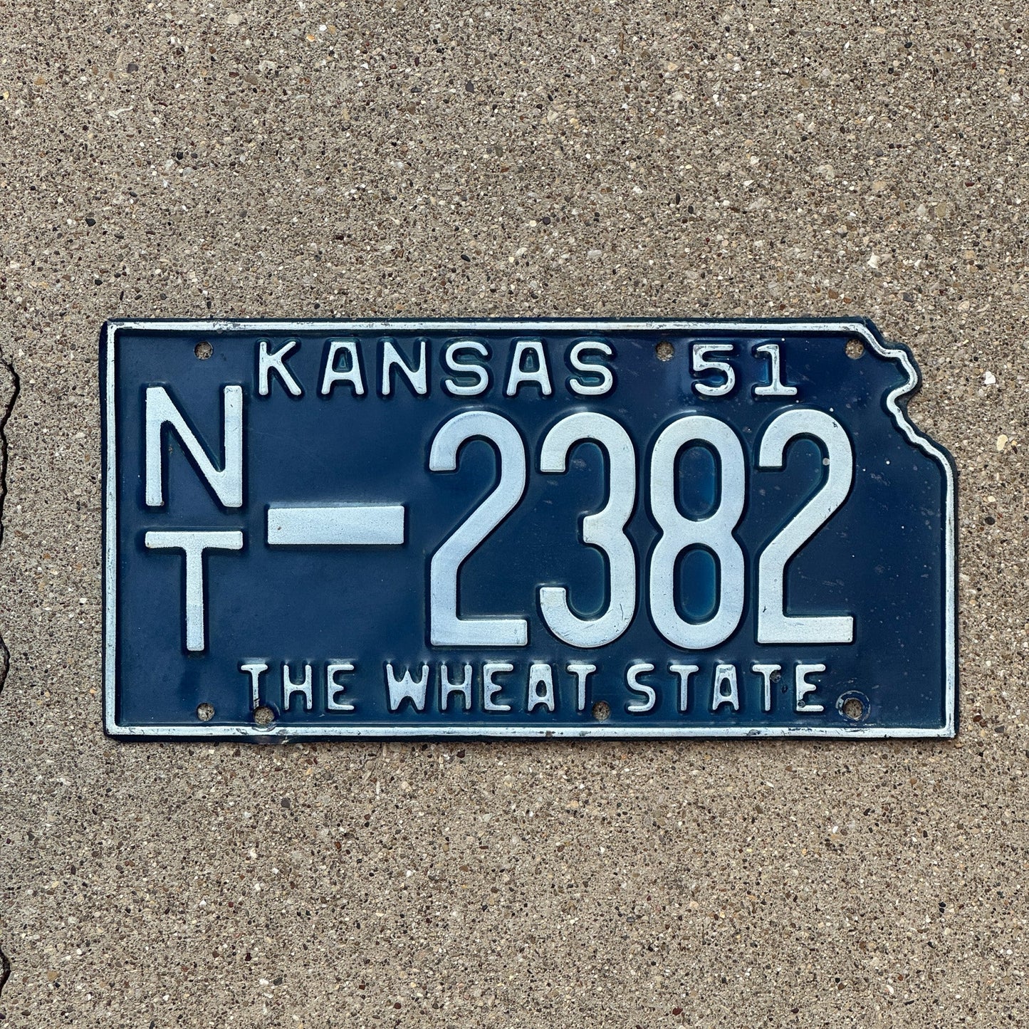 Photo of a 1951 Kansas License Plate Auto Tag Garage Decor Vintage Norton County State Shape NT 2382