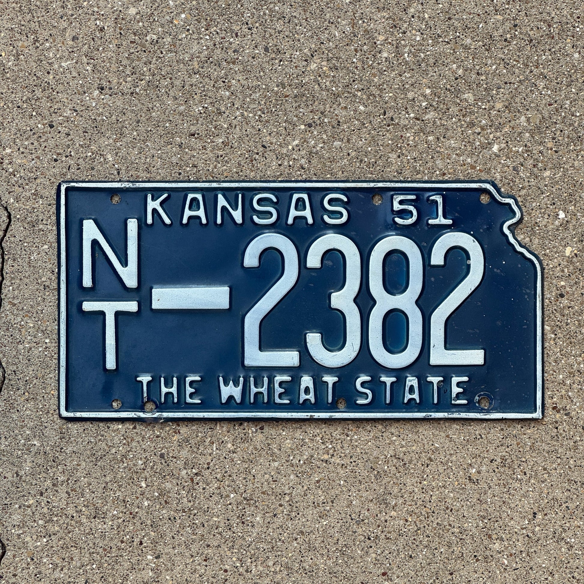 Photo of a 1951 Kansas License Plate Auto Tag Garage Decor Vintage Norton County State Shape NT 2382