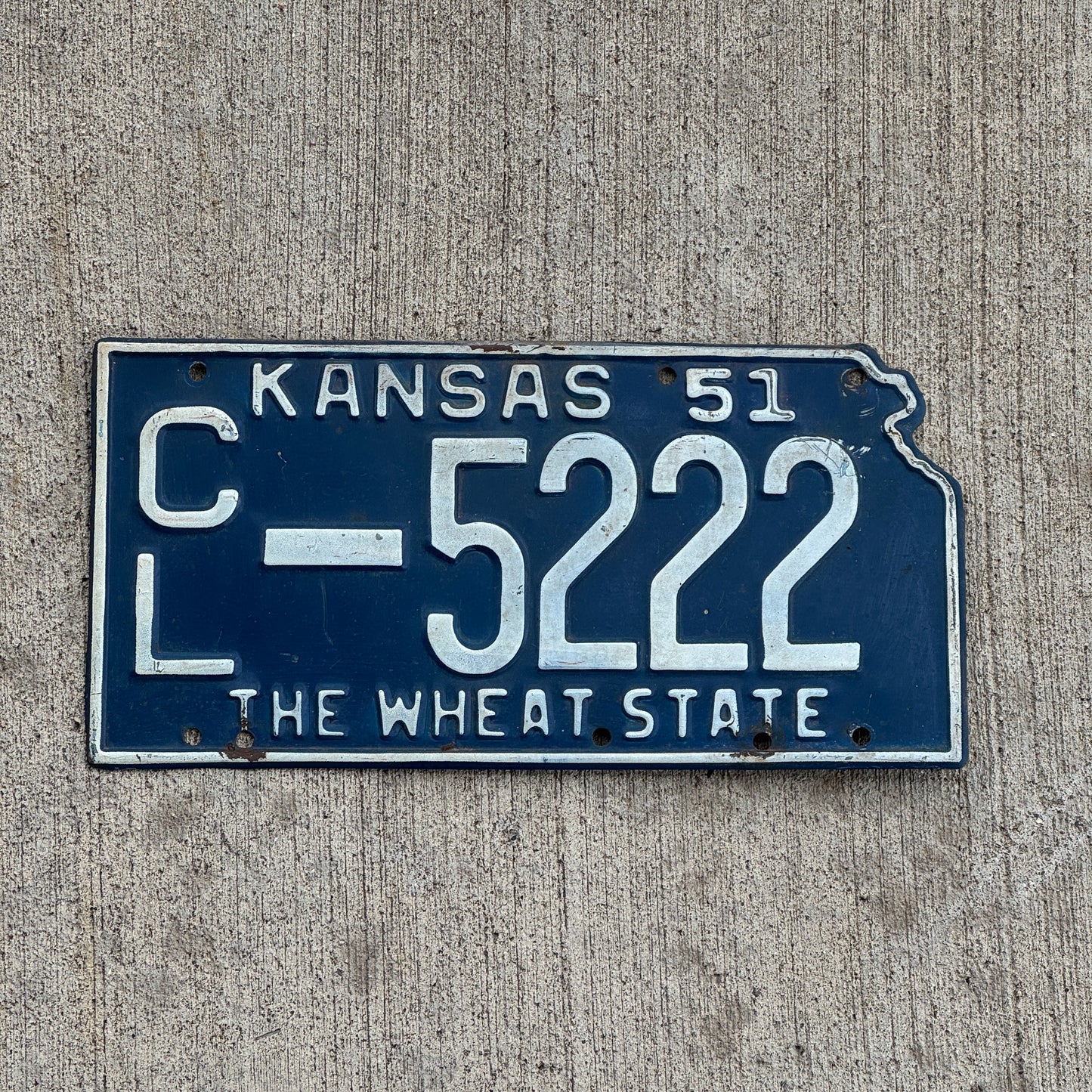 Photo of a 1951 Kansas License Plate Auto Tag Garage Decor Vintage State Shape Repeat Repeating CL 5222 with original patina