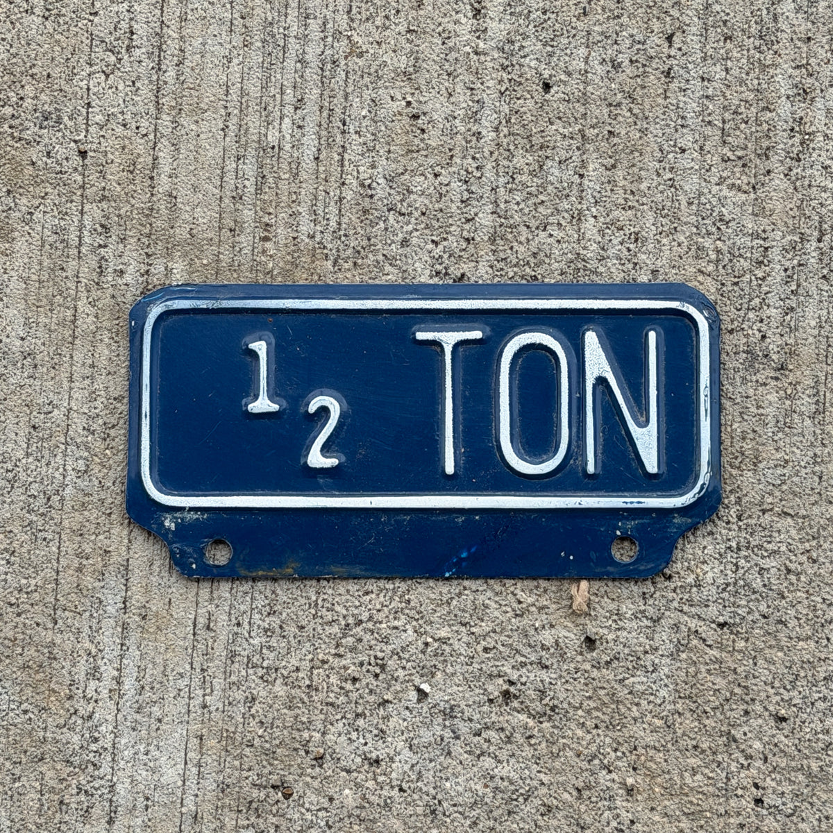 Photo of a 1951 Kansas Truck License Plate Auto Tag Garage Decor Vintage 1/2 Ton Weight Supplementary Topper with original patina