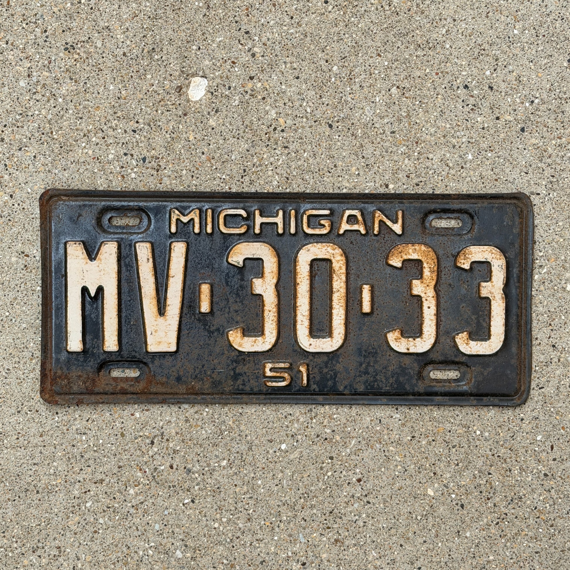 Photo of a 1951 Michigan License Plate Auto Tag Garage Decor Vintage MV 30 33 with original patina