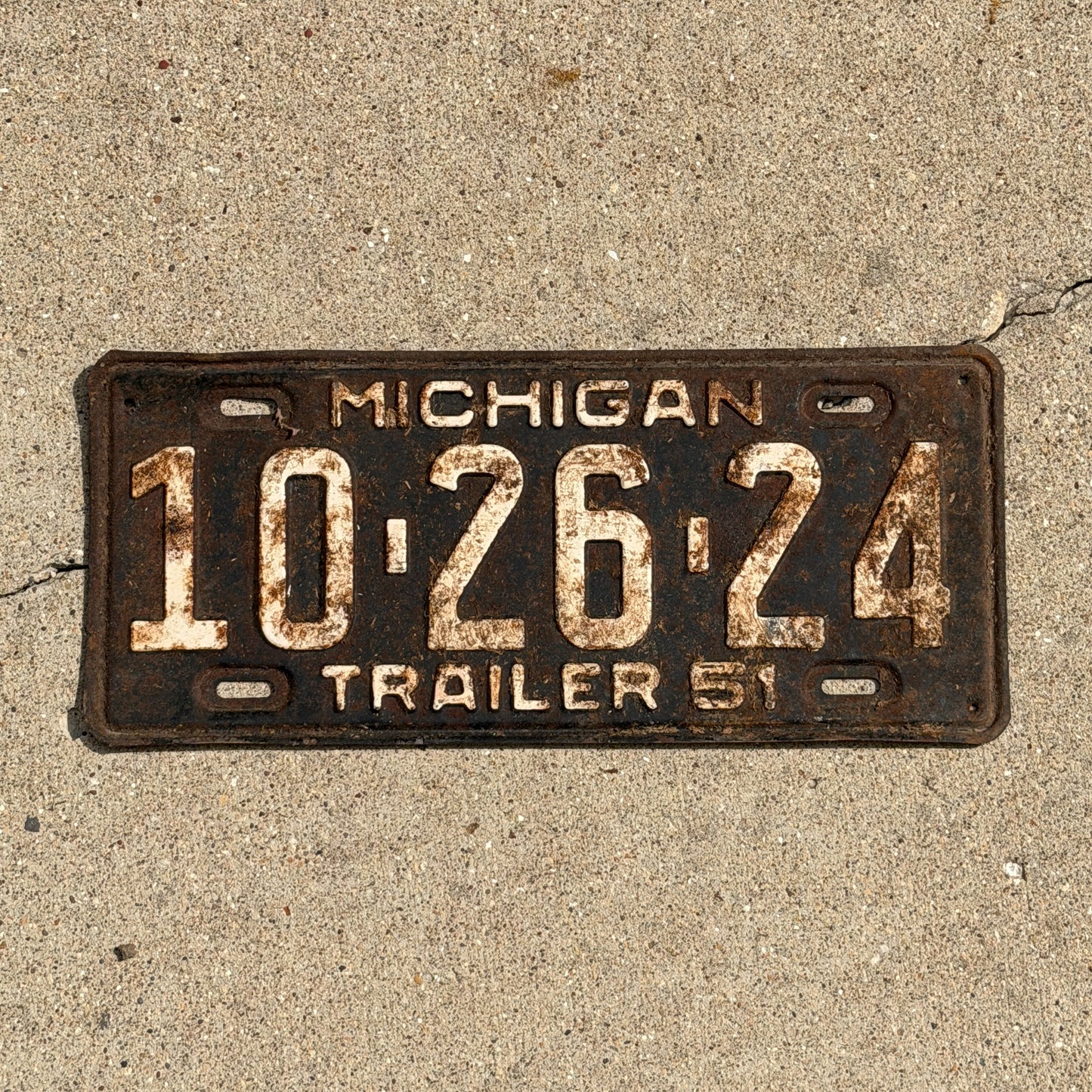 Photo of a 1951 Michigan Trailer License Plate Auto Tag Garage Decor Vintage 10 26 24 with original patina