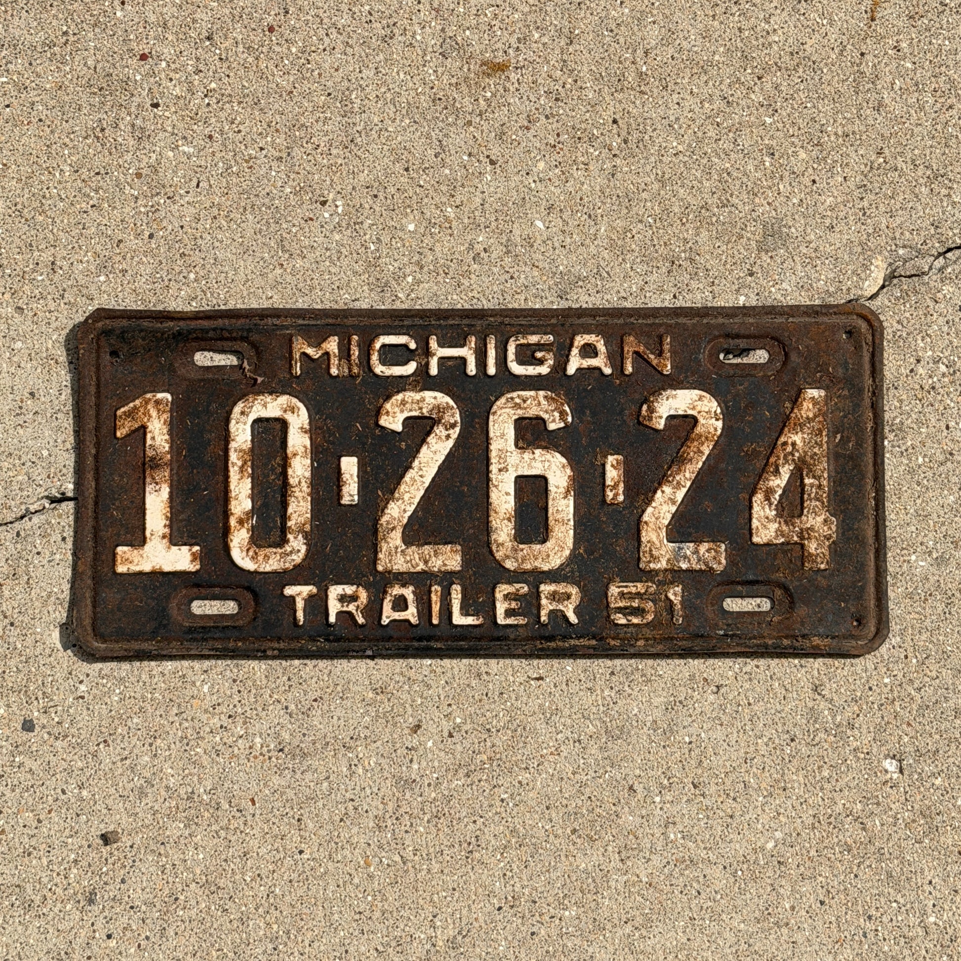 Photo of a 1951 Michigan Trailer License Plate Auto Tag Garage Decor Vintage 10 26 24 with original patina