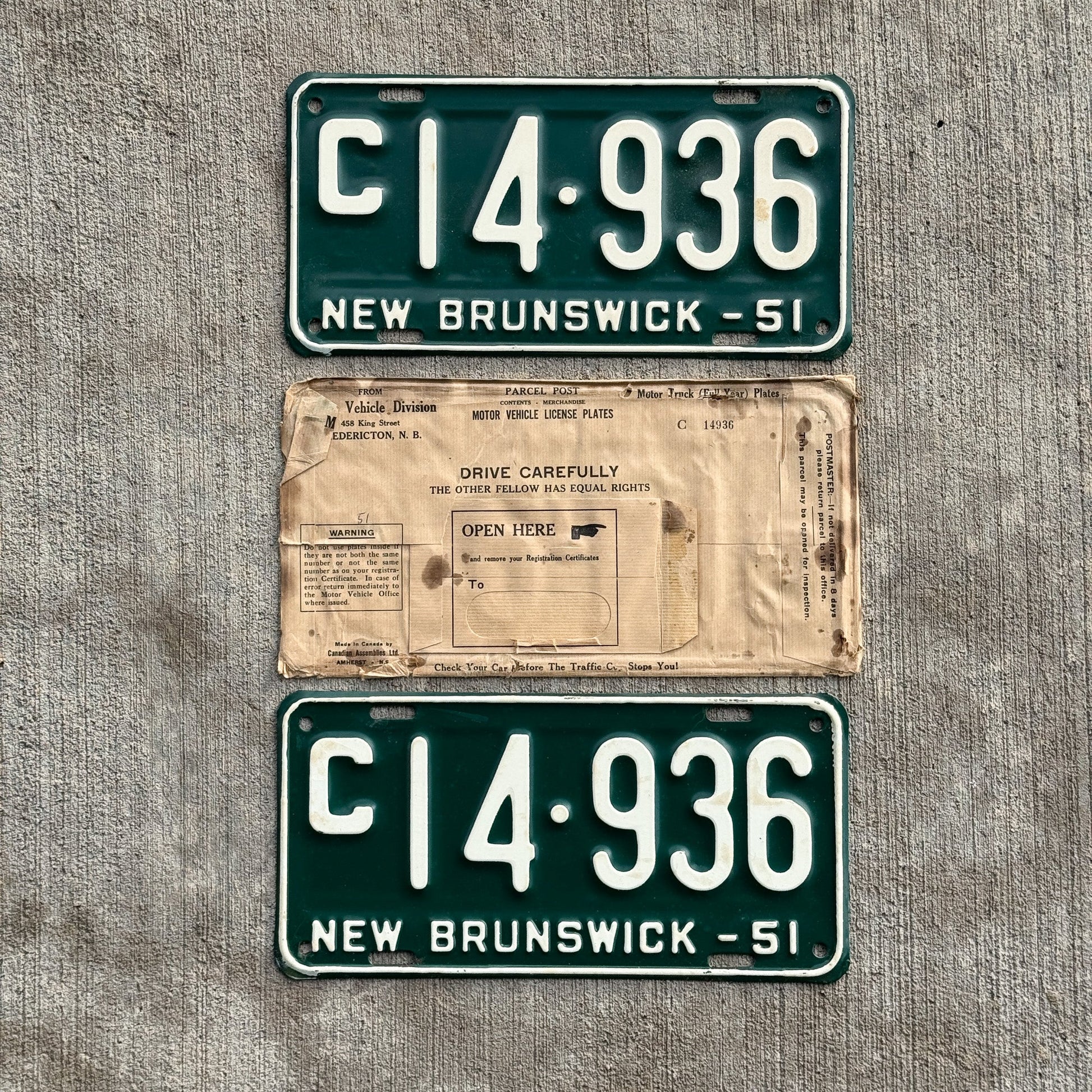 Photo of a 1951 New Brunswick Commercial License Plate Pair Auto Tag Garage Decor Vintage With Envelope Truck C 14 936 with original patina