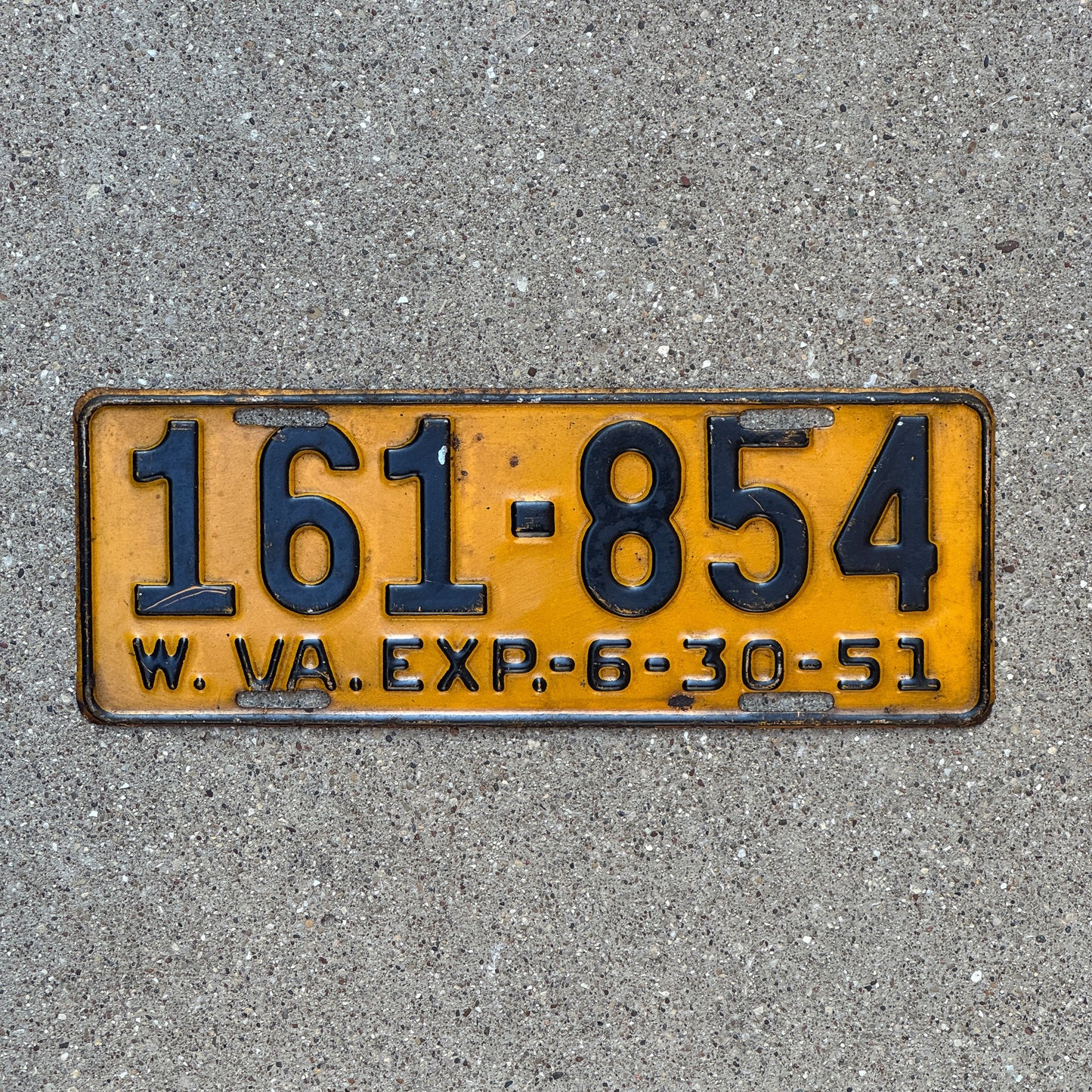 Photo of a 1951 West Virginia License Plate Auto Tag Garage Decor Vintage 161 854 with original patina