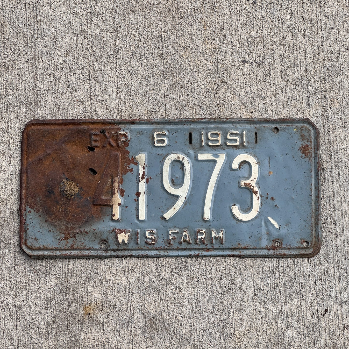Photo of a 1951 Wisconsin Farm License Plate Auto Tag Garage Decor Vintage 41973 with original patina
