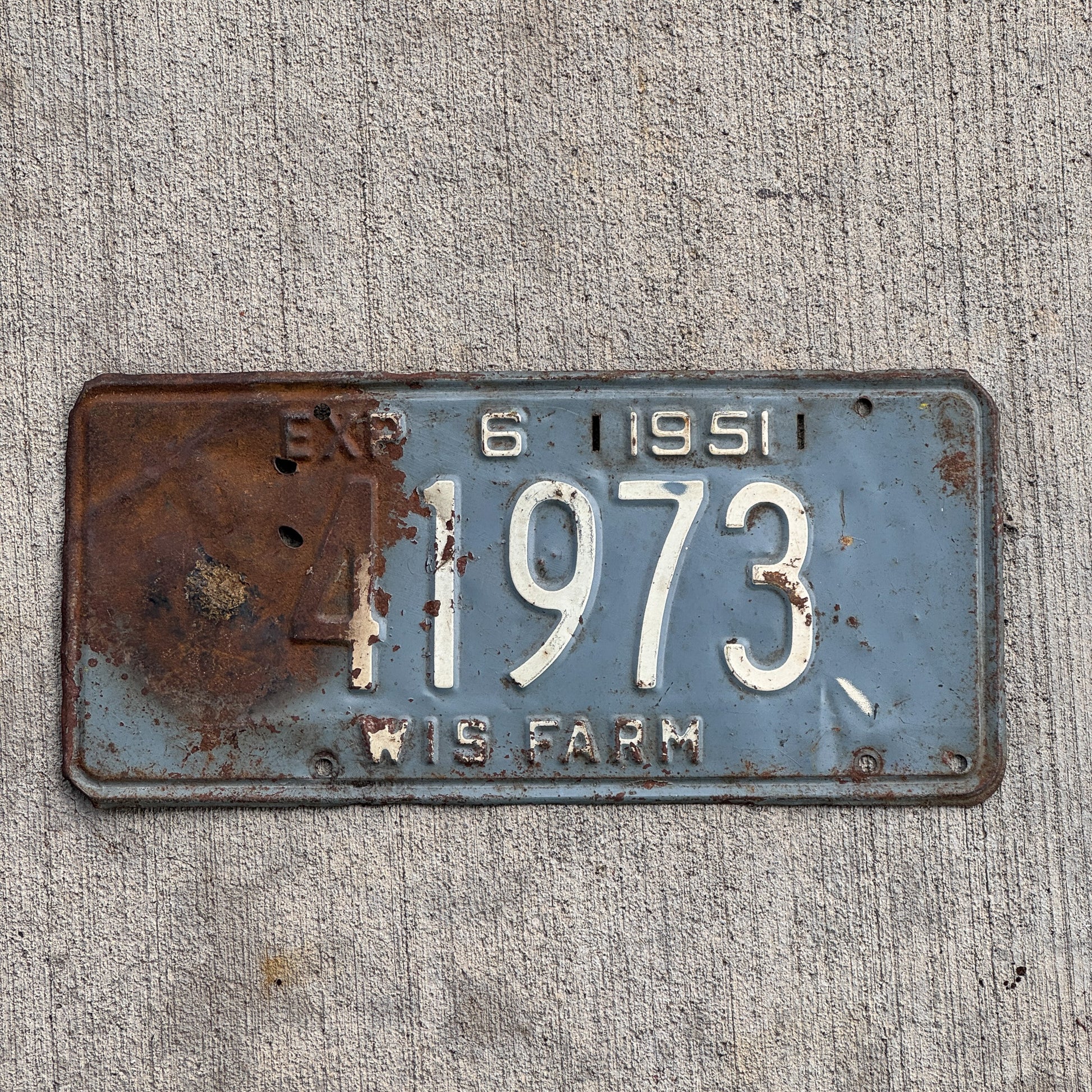 Photo of a 1951 Wisconsin Farm License Plate Auto Tag Garage Decor Vintage 41973 with original patina