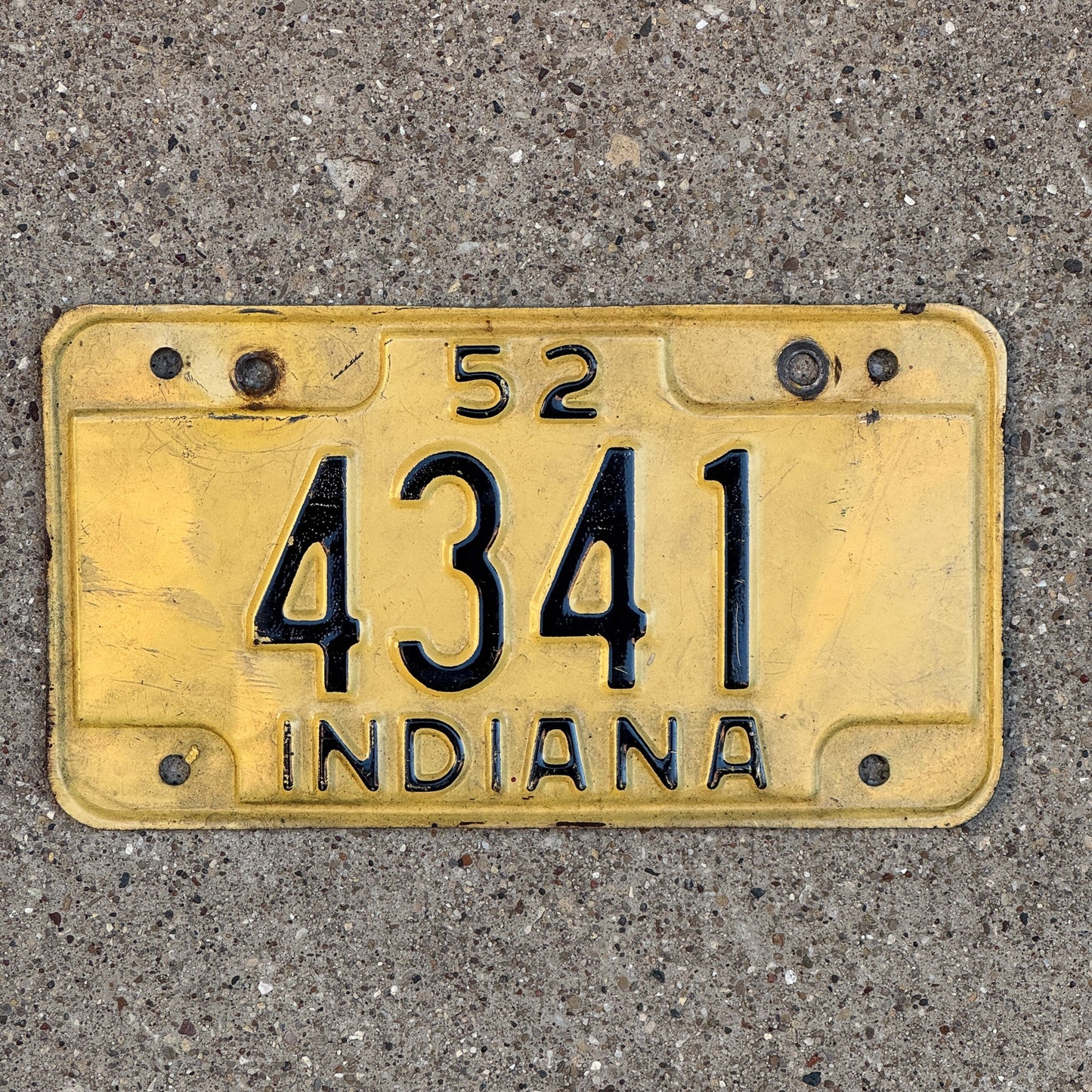 Photo of a 1952 Indiana Motorcycle License Plate Auto Tag Garage Decor Vintage Low Number Four Digit 4341 with original patina
