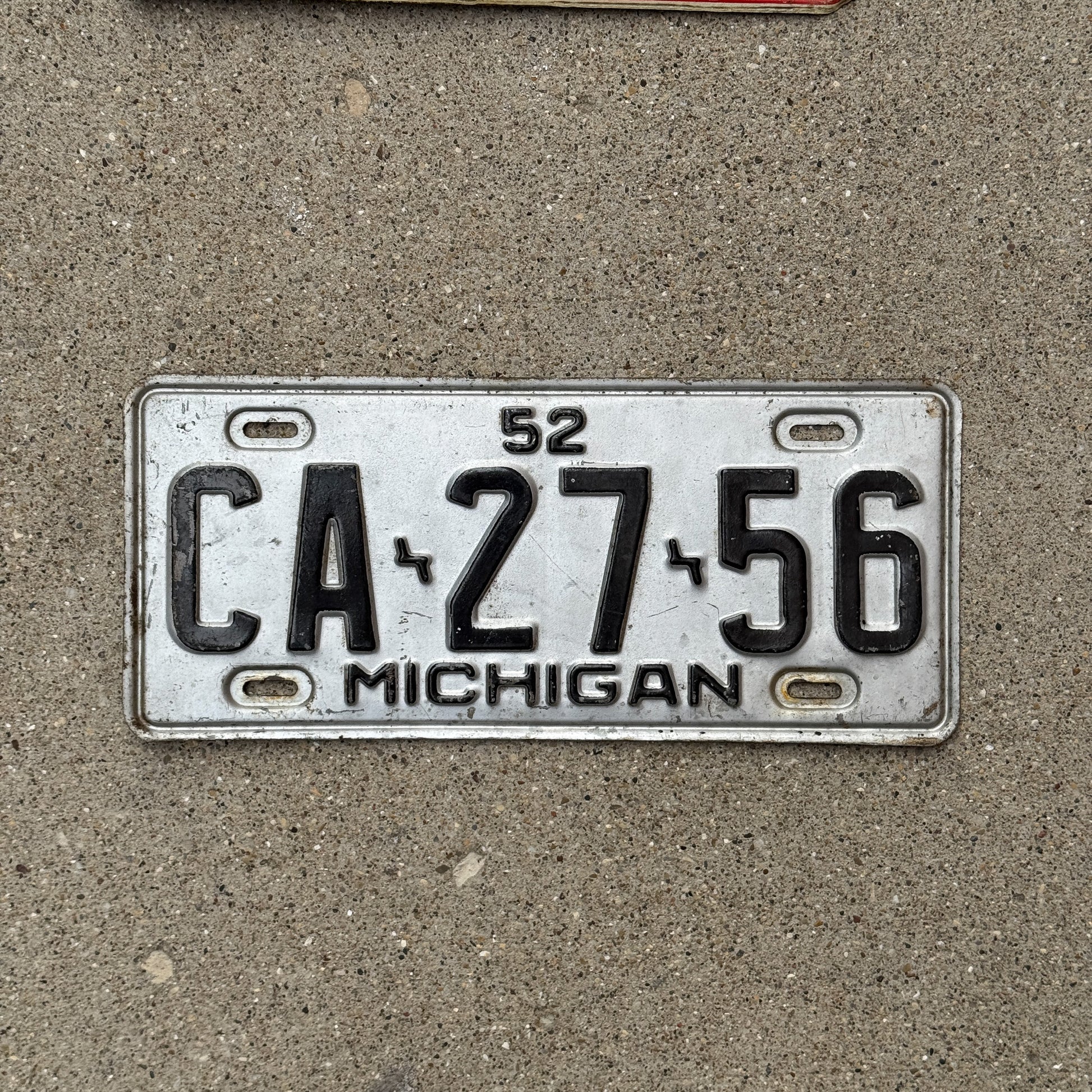 Photo of a 1952 Michigan License Plate Auto Tag Garage Decor Vintage CA 27 56 with original patina