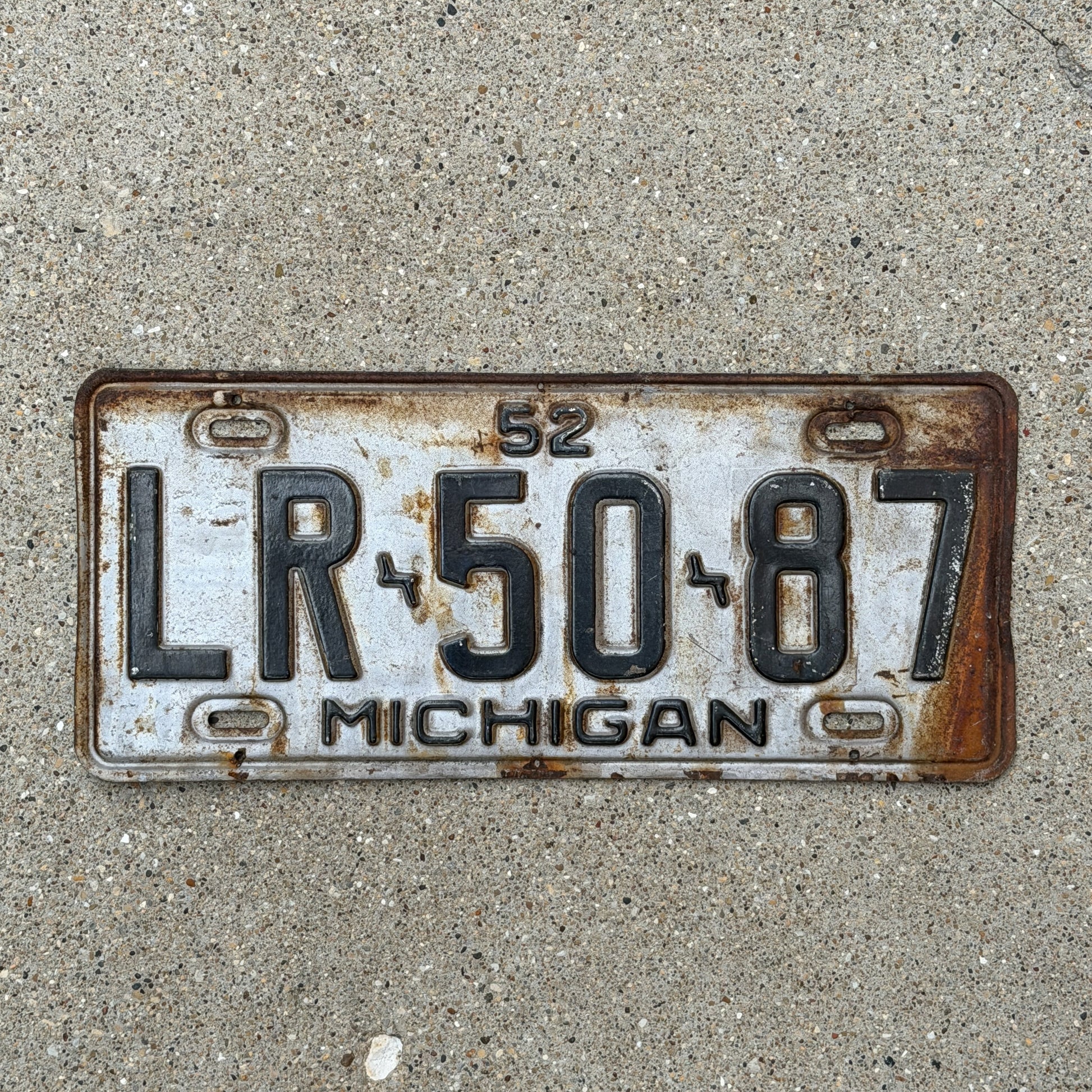 Photo of a 1952 Michigan License Plate Auto Tag Garage Decor Vintage LR 50 87 with original patina
