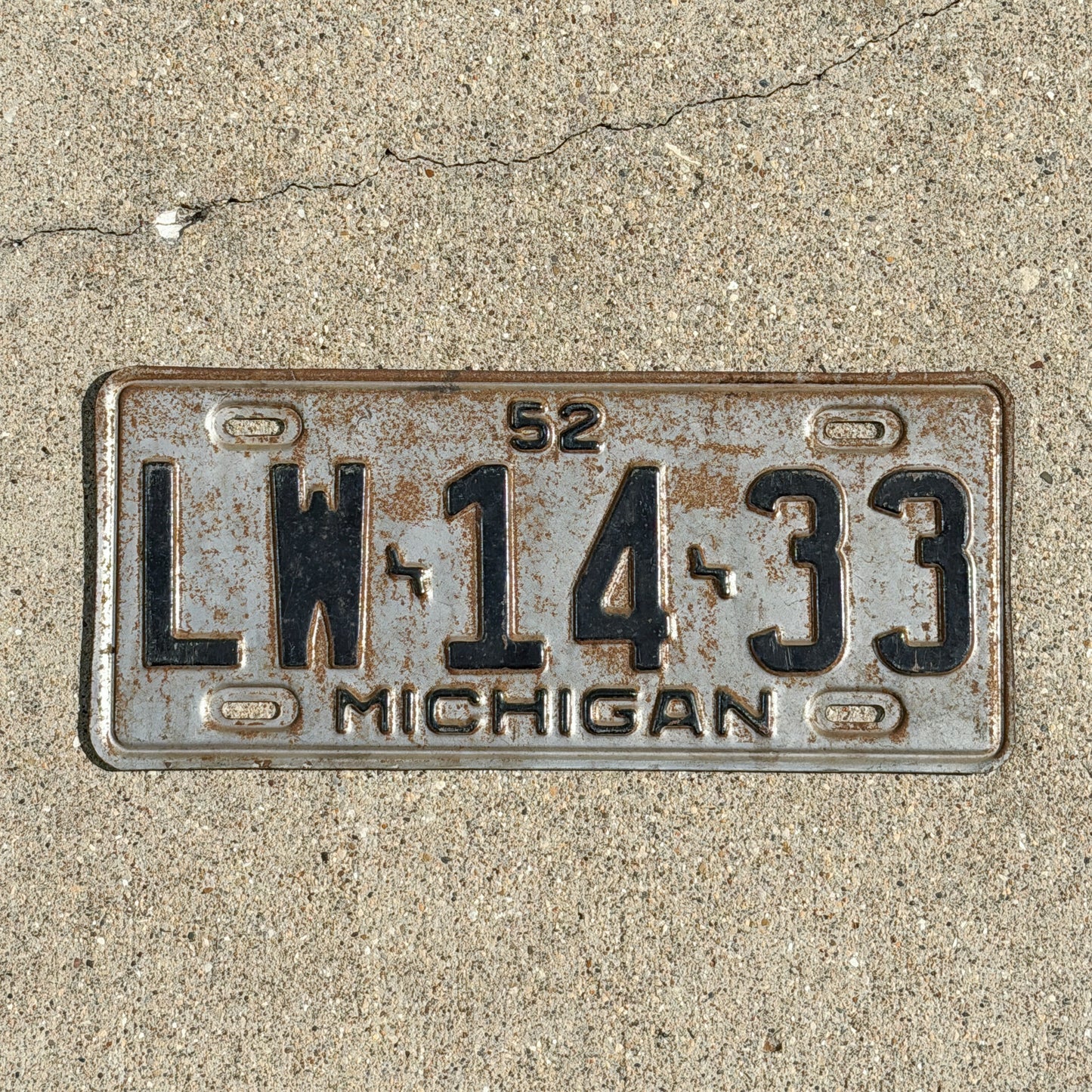 Photo of a 1952 Michigan License Plate Auto Tag Garage Decor Vintage LW 14 33 with original patina