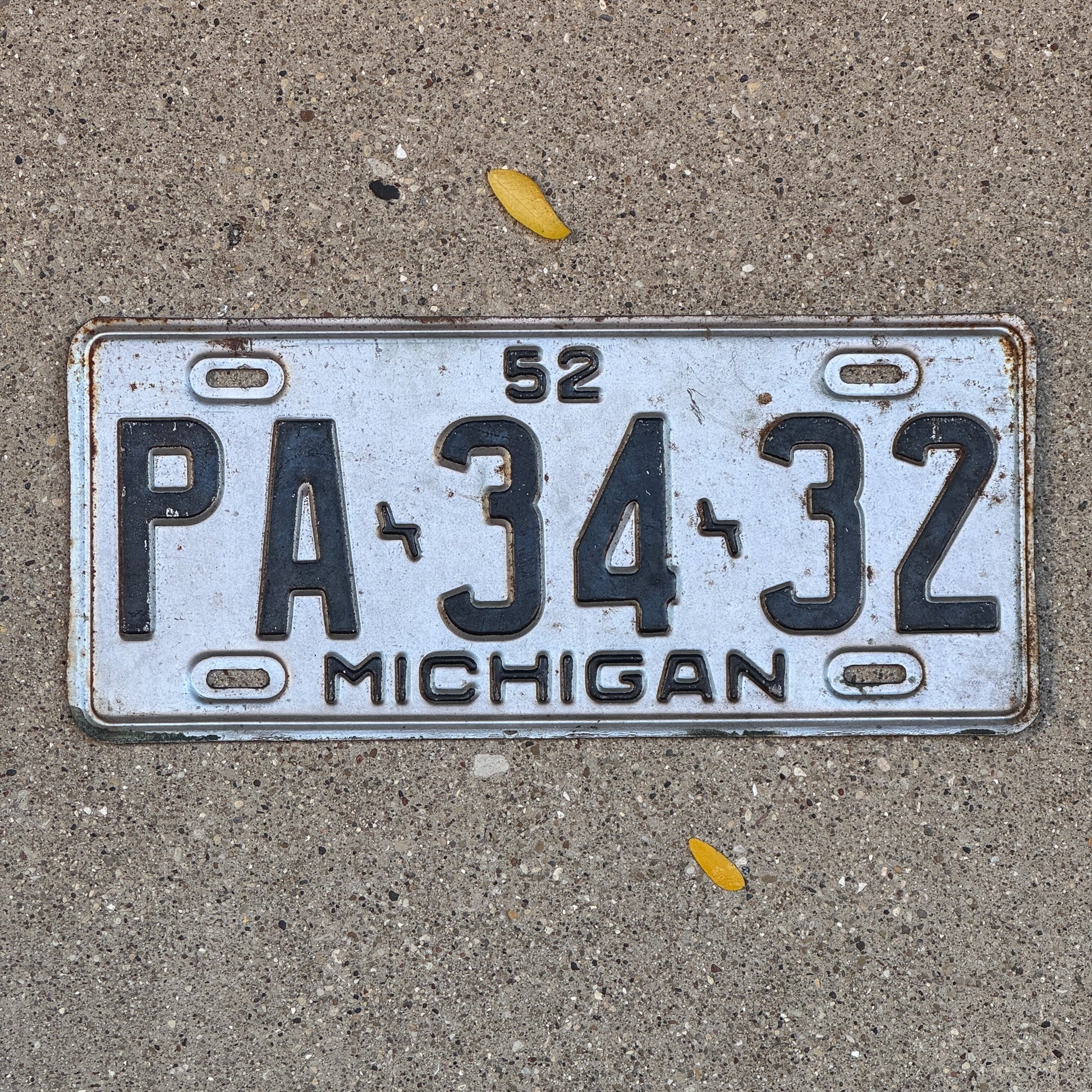 Photo of a 1952 Michigan License Plate Auto Tag Garage Decor Vintage PA 3432 with original patina