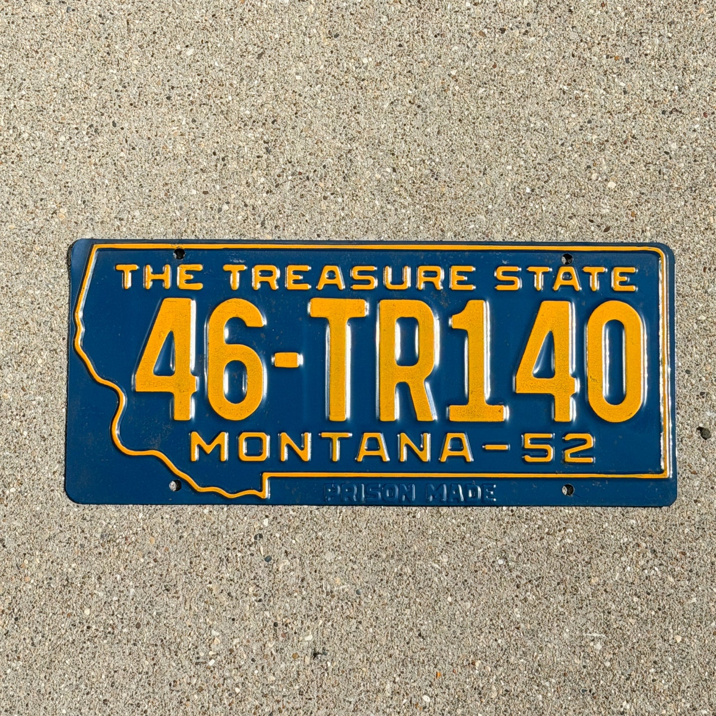 Photo of a 1952 Montana Trailer License Plate Auto Tag Garage Decor Vintage State Shape 46 TR 140 with original patina