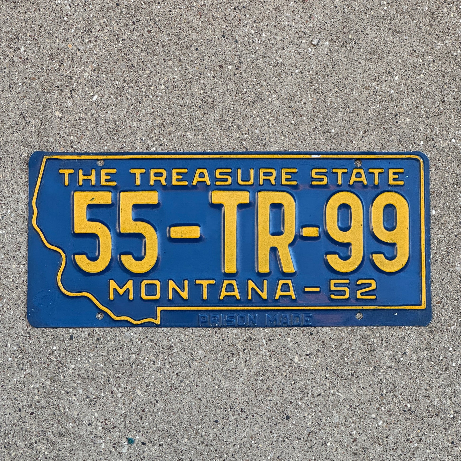 Photo of a 1952 Montana Trailer License Plate Auto Tag Garage Decor Vintage State Shape Petroleum County 55 TR 99 with original patina