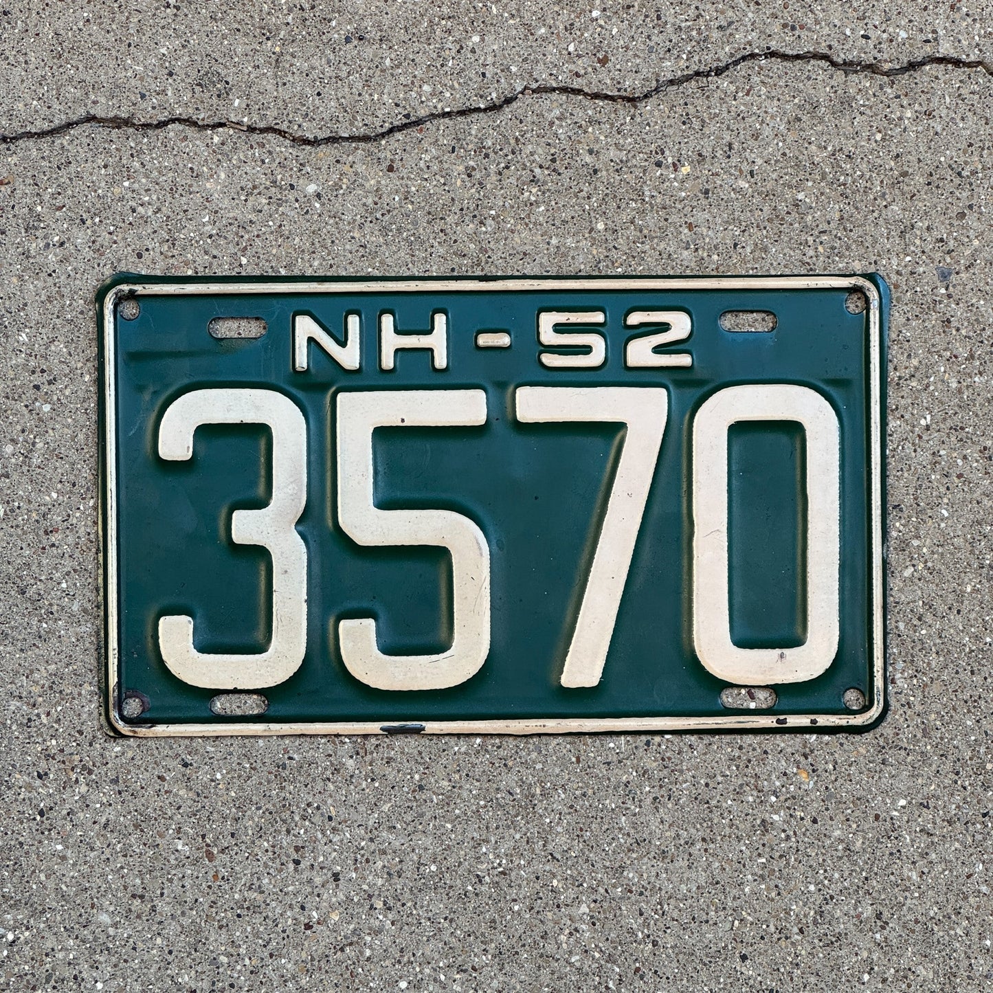 Photo of a 1952 New Hampshire License Plate Auto Tag Garage Decor Vintage Low Number Four Digit 3570 with original patina