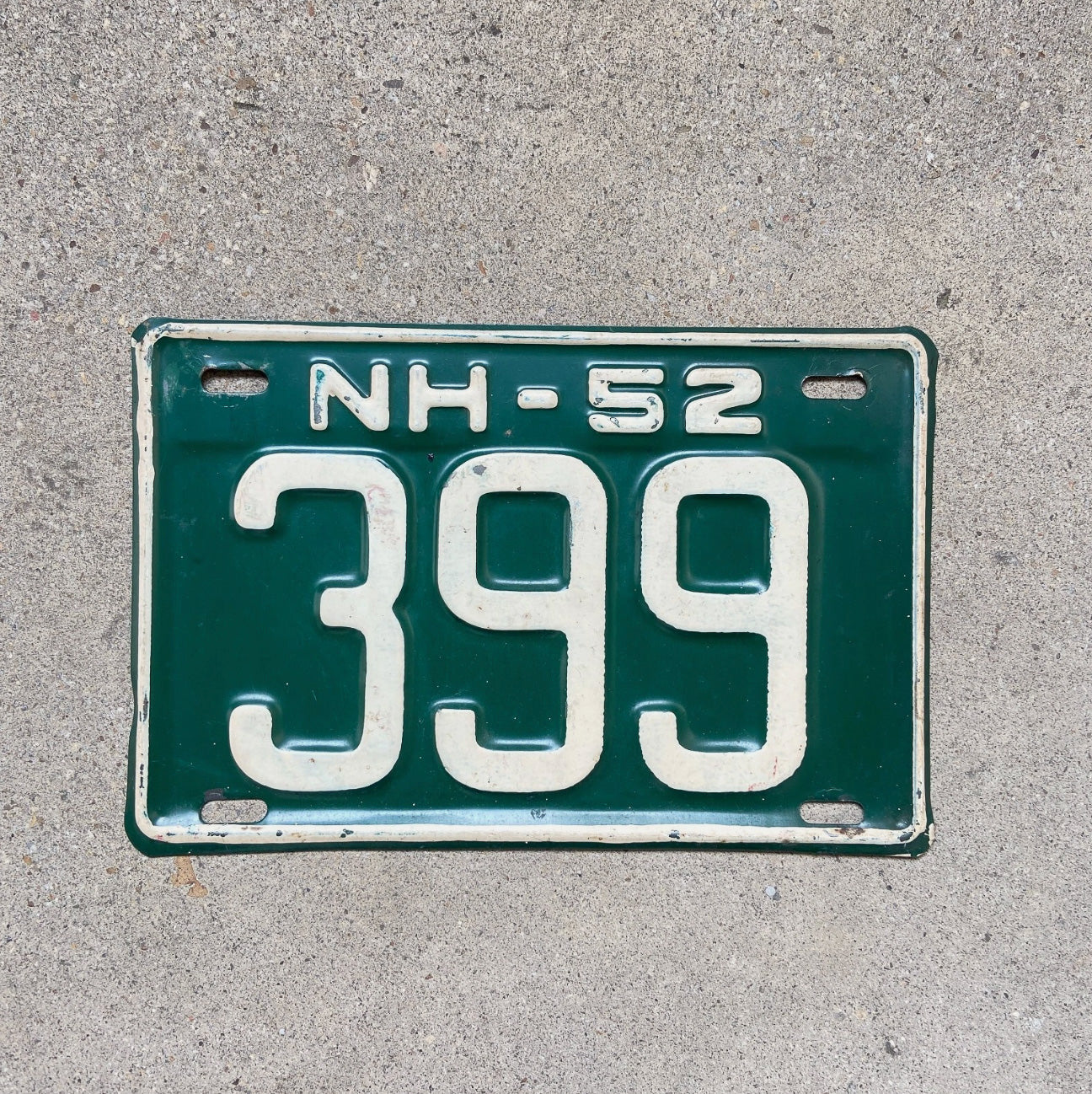 Photo of a 1952 New Hampshire License Plate Auto Tag Garage Decor Vintage Low Number Three Digit 399 with original patina