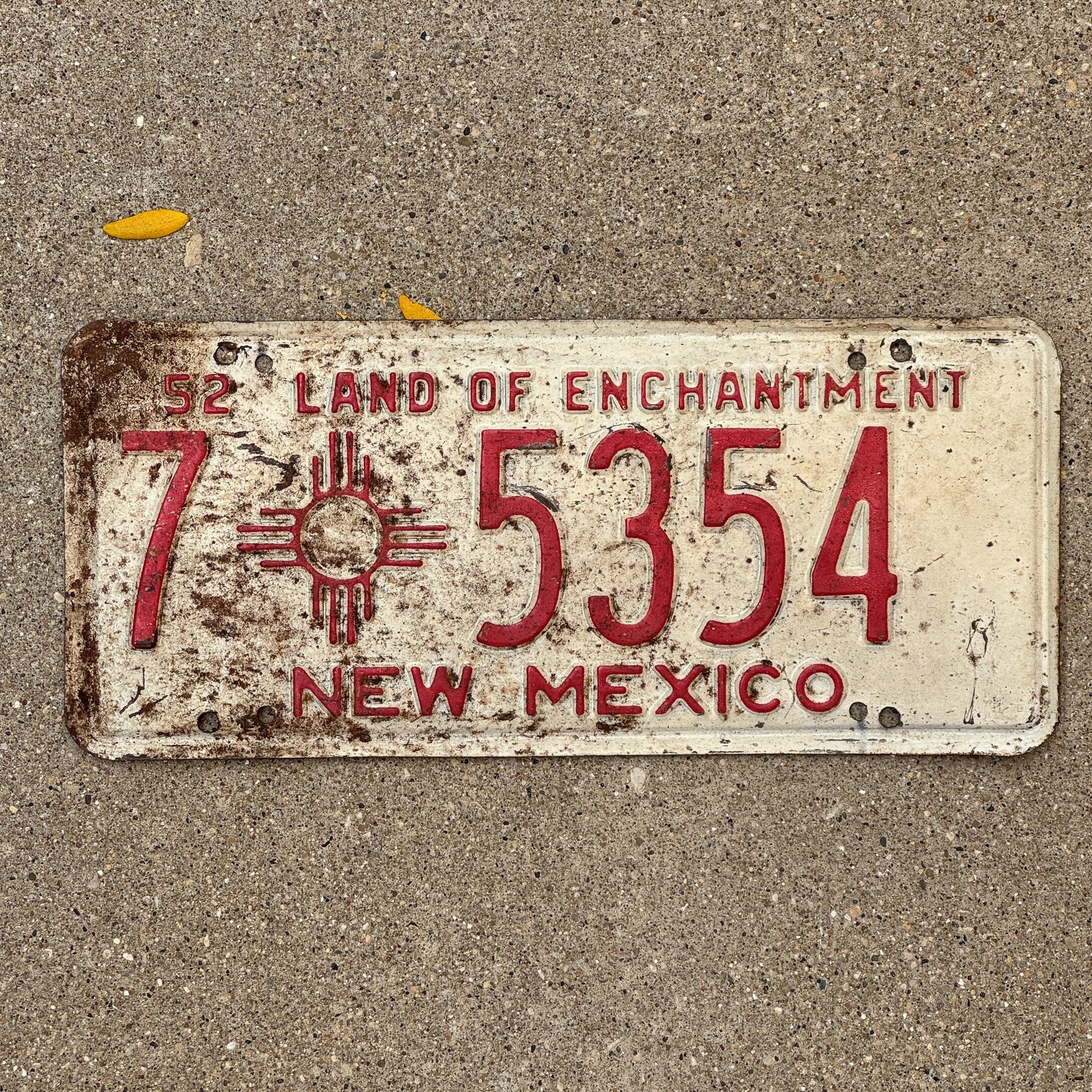 Photo of a 1952 New Mexico License Plate Auto Tag Garage Decor Vintage Iconic Zia 7 5354 with original patina