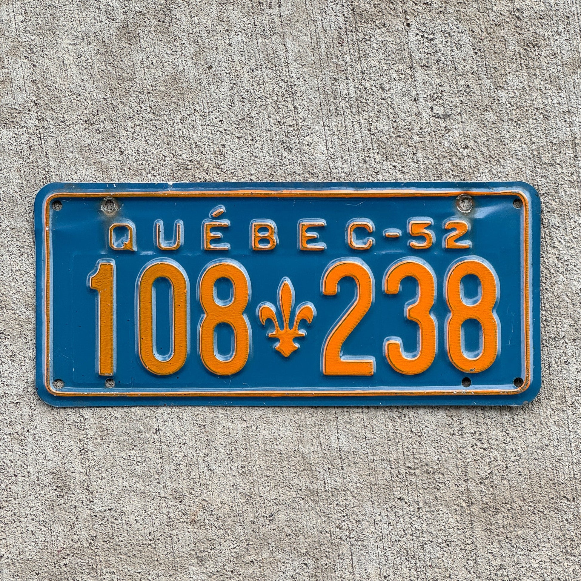 Photo of a 1952 Quebec License Plate Auto Tag Garage Decor Vintage High Quality 108 238 with original patina