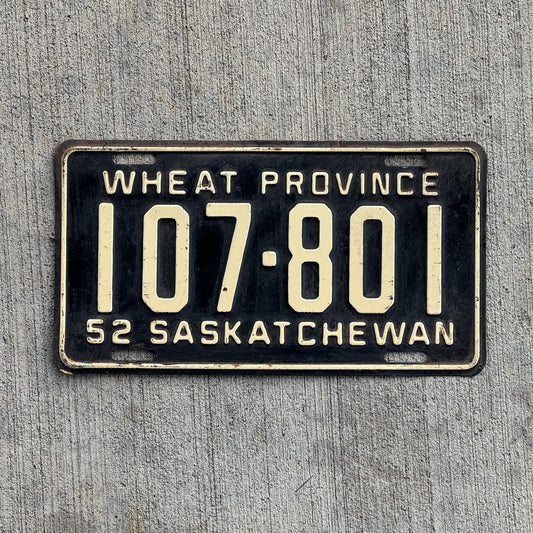 Photo of a 1952 Saskatchewan License Plate Auto Tag Garage Decor Vintage Wheat Province 107 801 with original patina