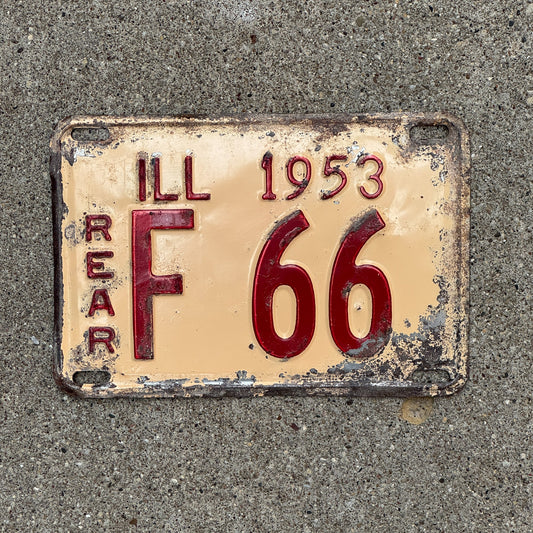 Photo of a 1953 Illinois Truck License Plate Auto Tag Garage Decor Vintage Low Number Two Digit F 66 with original patina