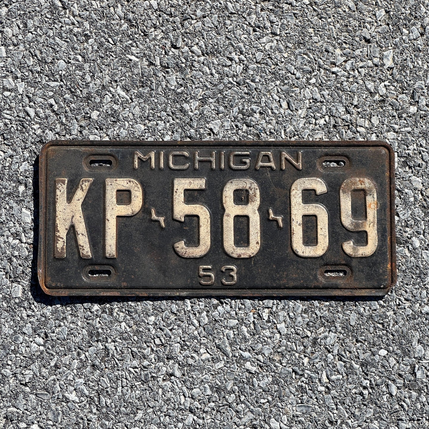 Photo of a 1953 Michigan License Plate Auto Tag Garage Decor Vintage KP 5869
