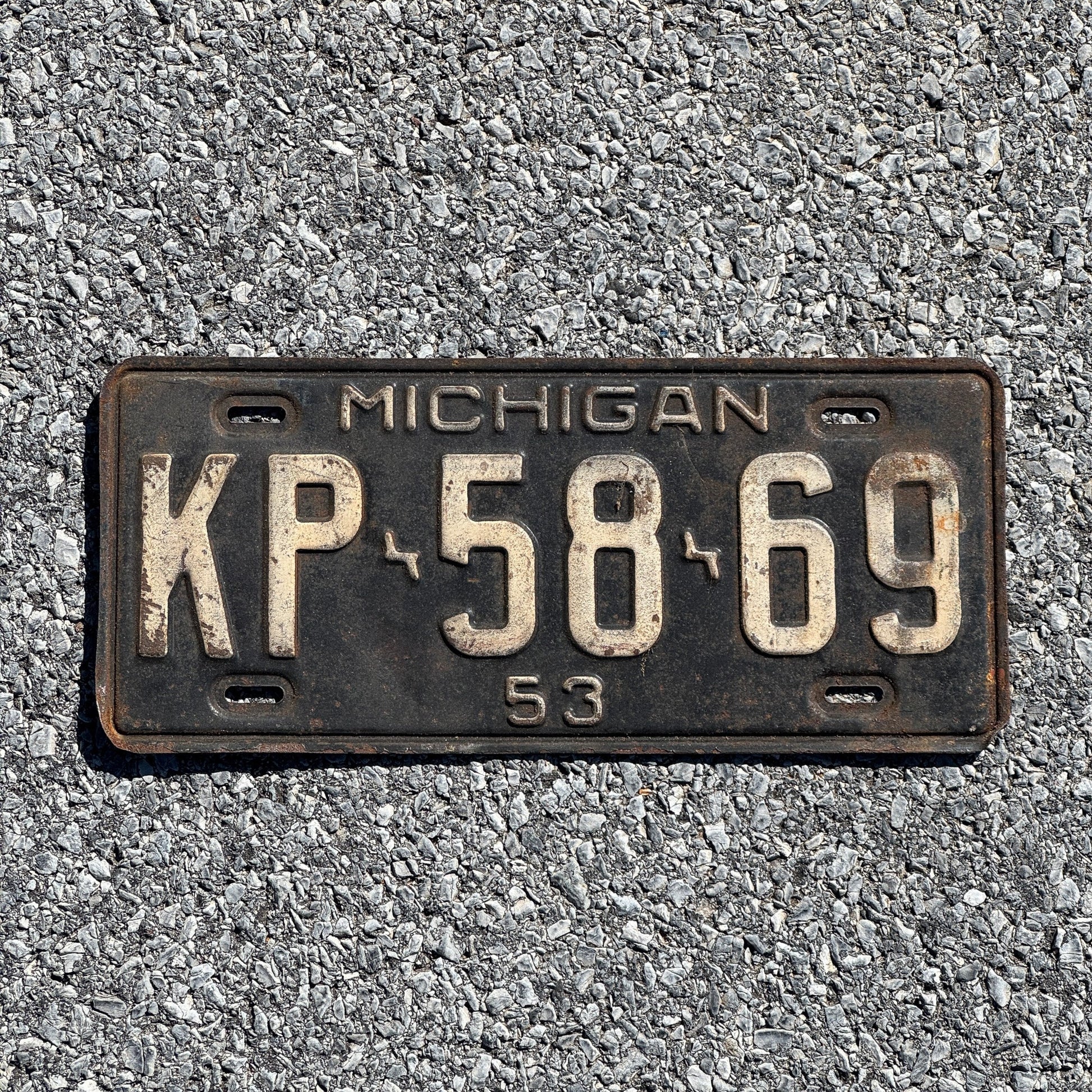 Photo of a 1953 Michigan License Plate Auto Tag Garage Decor Vintage KP 5869