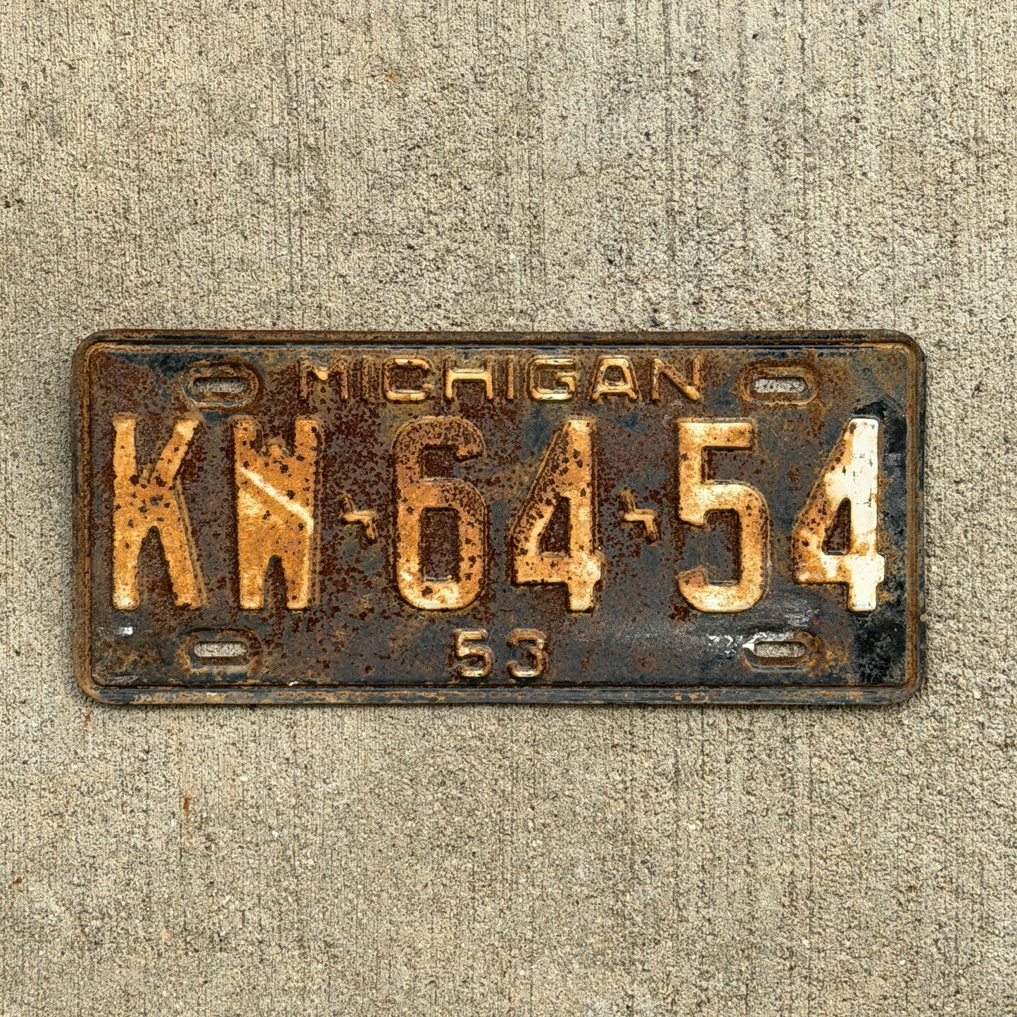 Photo of a 1953 Michigan License Plate Auto Tag Garage Decor Vintage KW 64 54 with original patina