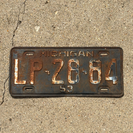 Photo of a 1953 Michigan License Plate Auto Tag Garage Decor Vintage LP 28 84 with original patina