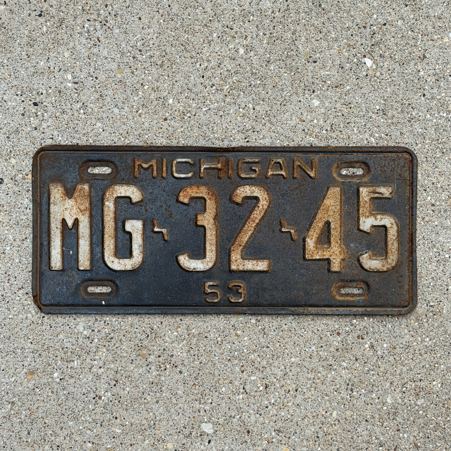 Photo of a 1953 Michigan License Plate Auto Tag Garage Decor Vintage MG 32 45 with original patina