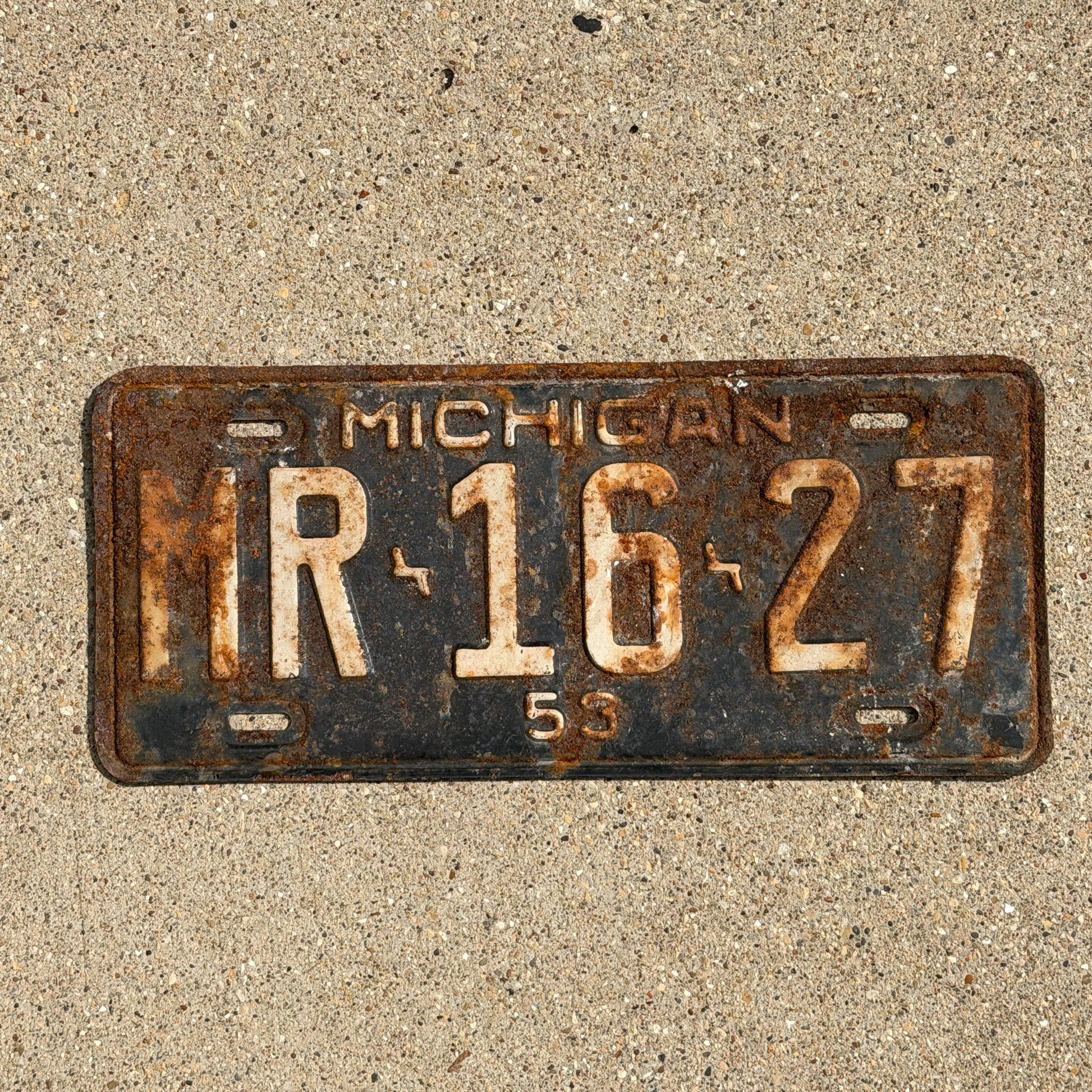 Photo of a 1953 Michigan License Plate Auto Tag Garage Decor Vintage MR 16 27 with original patina