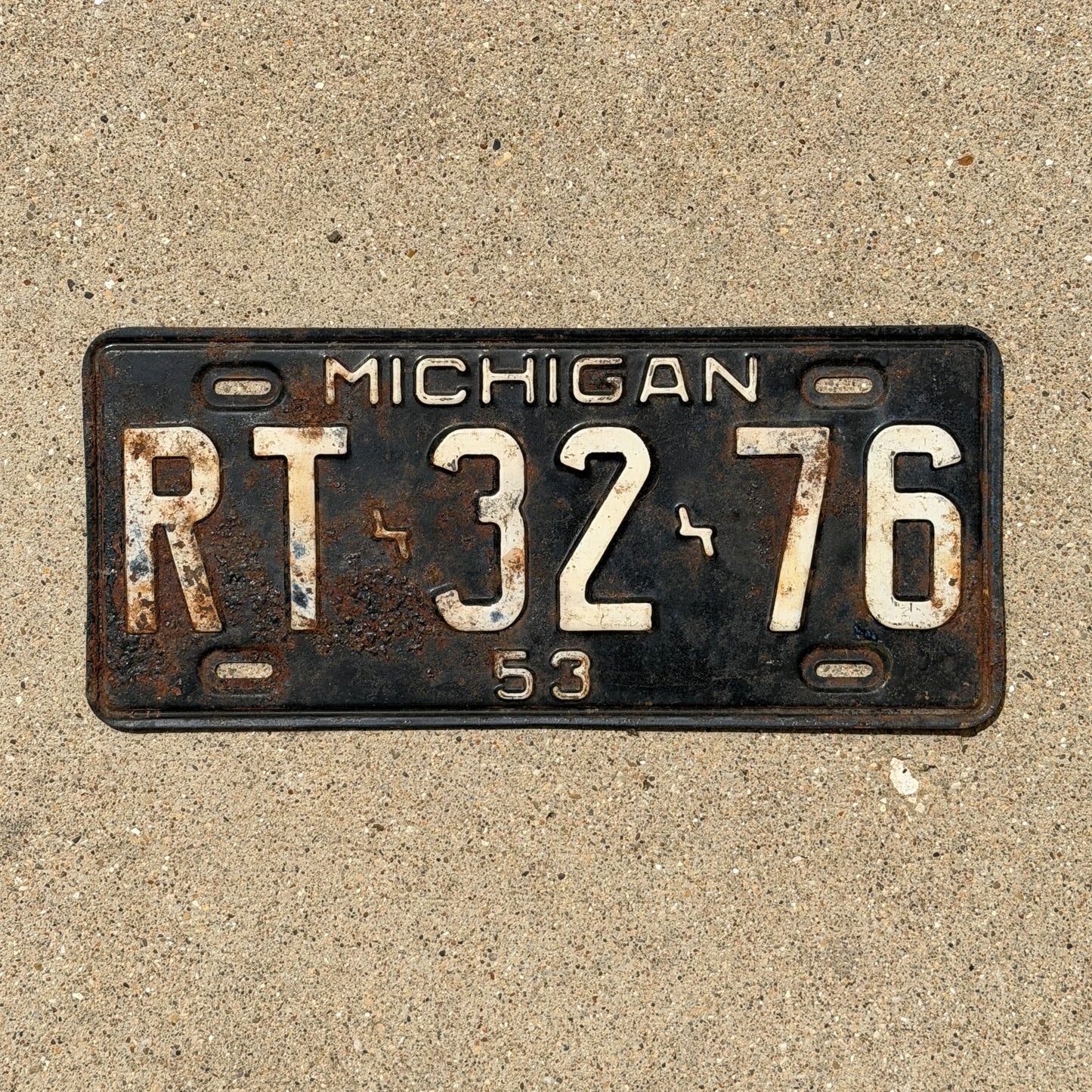 Photo of a 1953 Michigan License Plate Auto Tag Garage Decor Vintage RT 32 76 with original patina