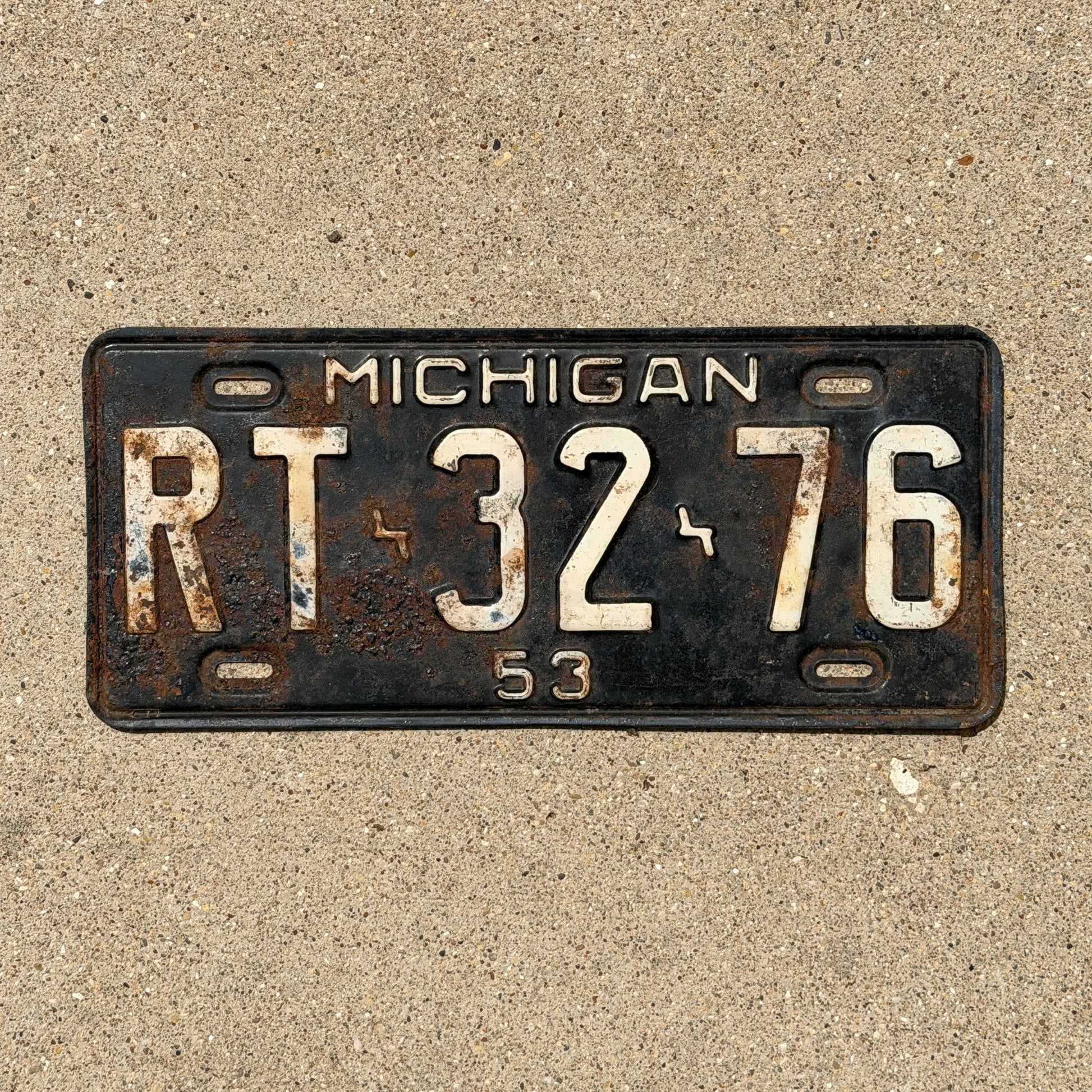Photo of a 1953 Michigan License Plate Auto Tag Garage Decor Vintage RT 32 76 with original patina