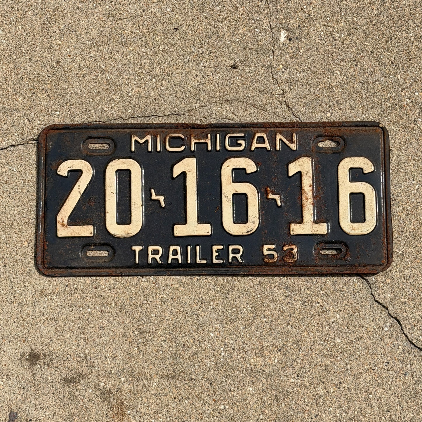 Photo of a 1953 Michigan Trailer License Plate Auto Tag Garage Decor Vintage 20 16 16 with original patina
