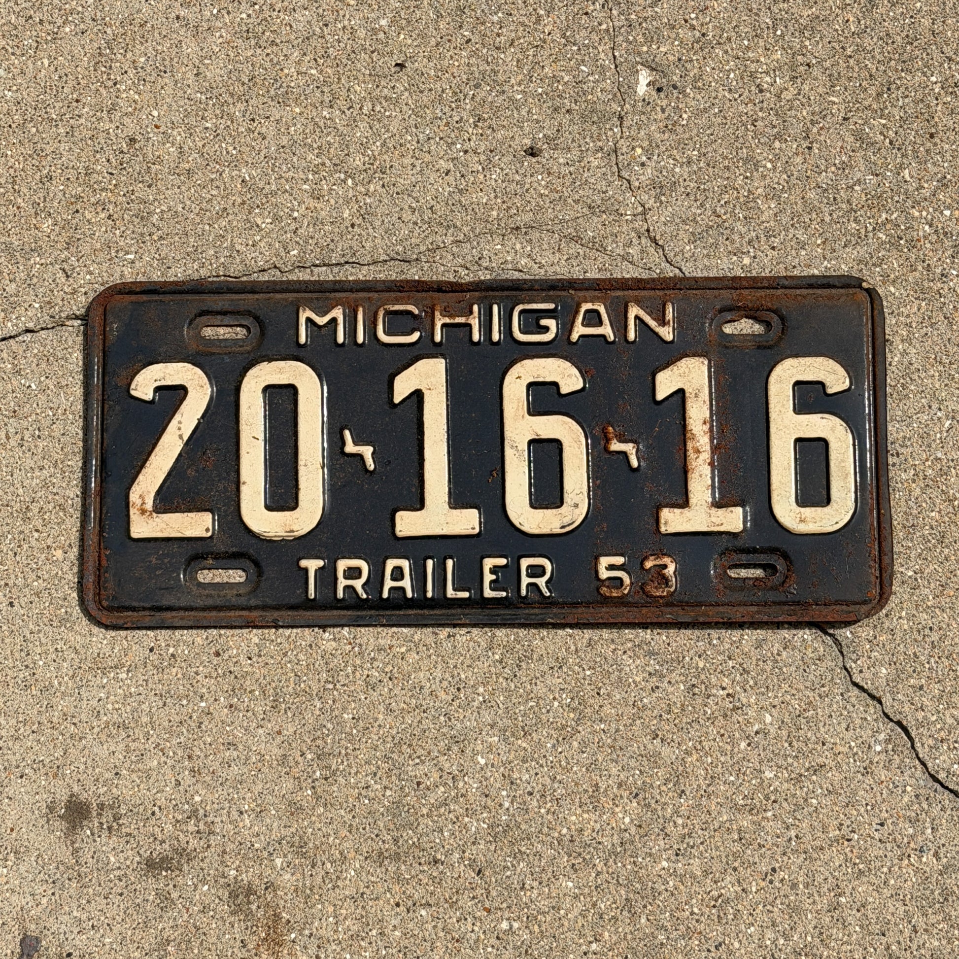 Photo of a 1953 Michigan Trailer License Plate Auto Tag Garage Decor Vintage 20 16 16 with original patina