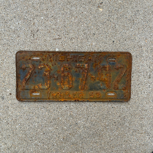 Photo of a 1953 Michigan Trailer License Plate Auto Tag Garage Decor Vintage 23 67 92 with original patina