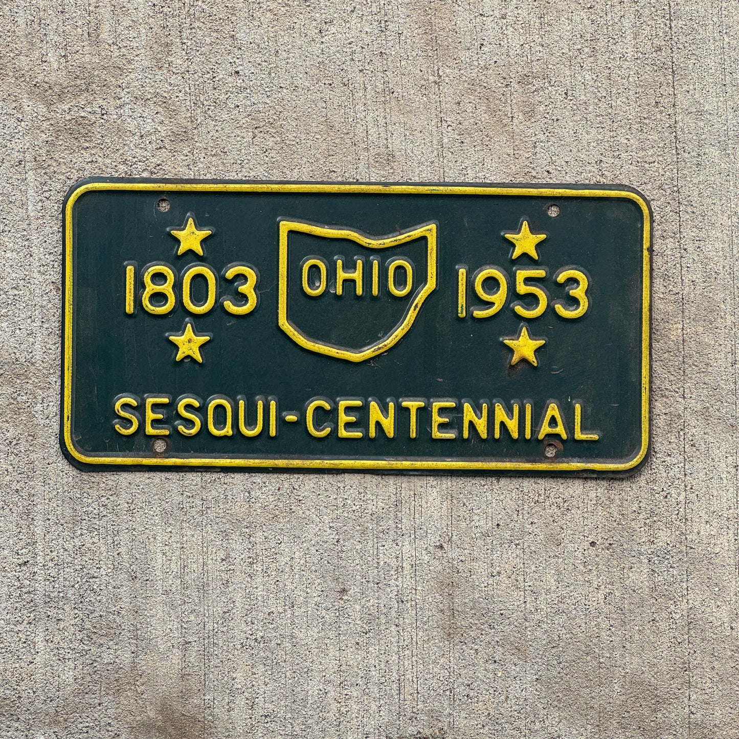 Photo of a 1953 Ohio Booster License Plate Auto Tag Garage Decor Vintage Sesquicentennial Collectible with original patina
