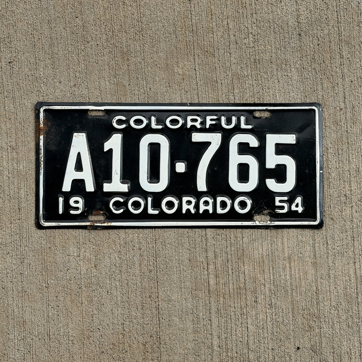 Photo of a 1954 Colorado License Plate Auto Tag Garage Decor Vintage Arapahoe County A10 765 with original patina