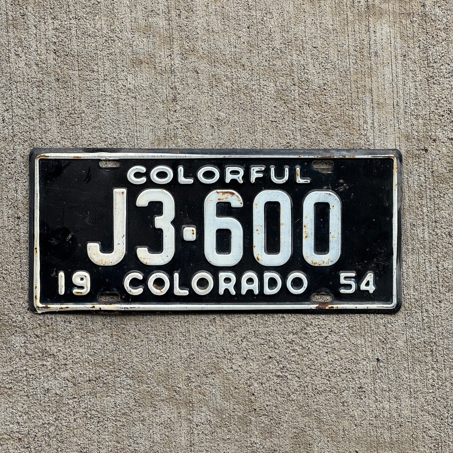 Photo of a 1954 Colorado License Plate Auto Tag Garage Decor Vintage J3 600 with original patina