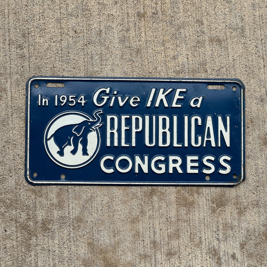 Photo of a 1954 Give Ike a Republican Congress Booster License Plate Auto Tag Garage Decor Vintage Eisenhower Politics Political with original patina